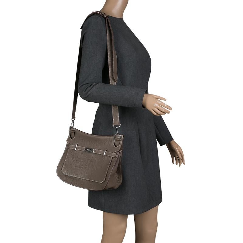 Hermes Jypsiere is a re-interpretation of the iconic Hermes Kelly. The messenger style bag is crafted from Etain Taurillon Clemence leather. The bag has a round bottom and features a thick adjustable shoulder strap that provides the needed comfort.