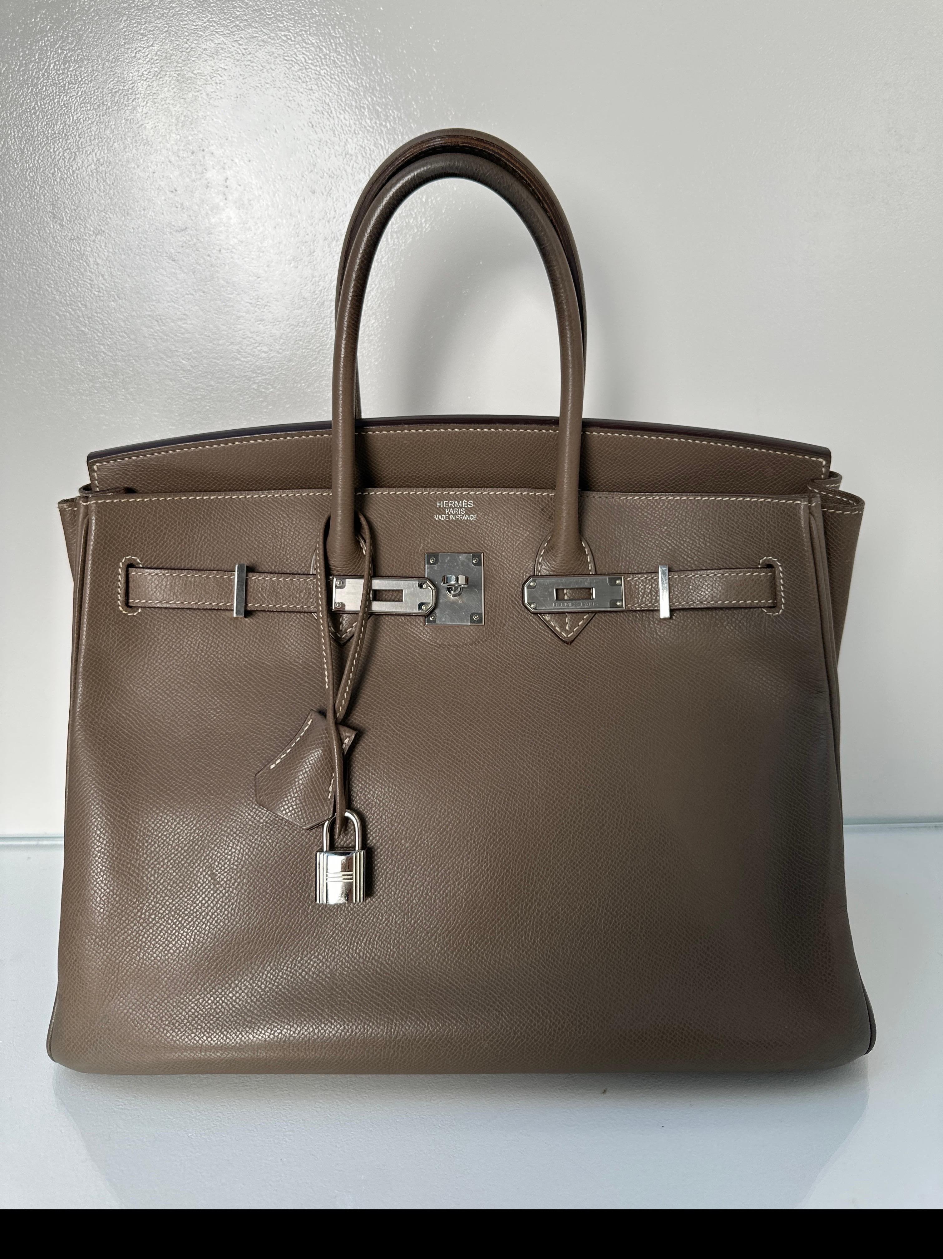 Hermes Etoupe Birkin 35 Bag. Grey color with palladium silver hardware. Good condition. Light wear from opening and closing bag. See photos near the closure. Plastic is still on the hardware. Interior clean. Handles have light wear and some