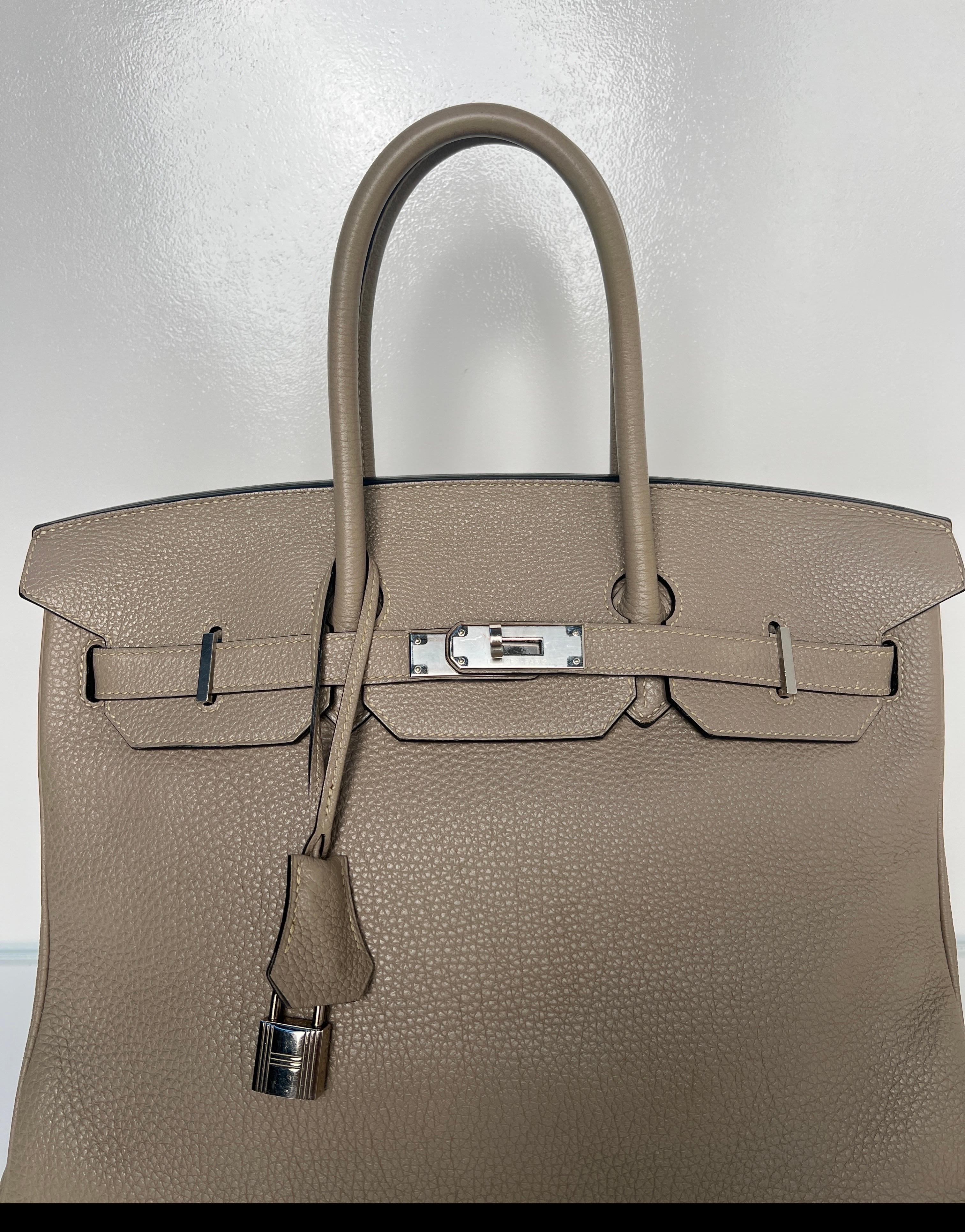 Hermes Etoupe Birkin 35 Bag. Gorgeous grey bag with silver palladium hardware. Interior clean. Excellent condition. Light grey color is a great neutral color. Includes clochette, lock, keys, and dust bag. Guaranteed authentic. 