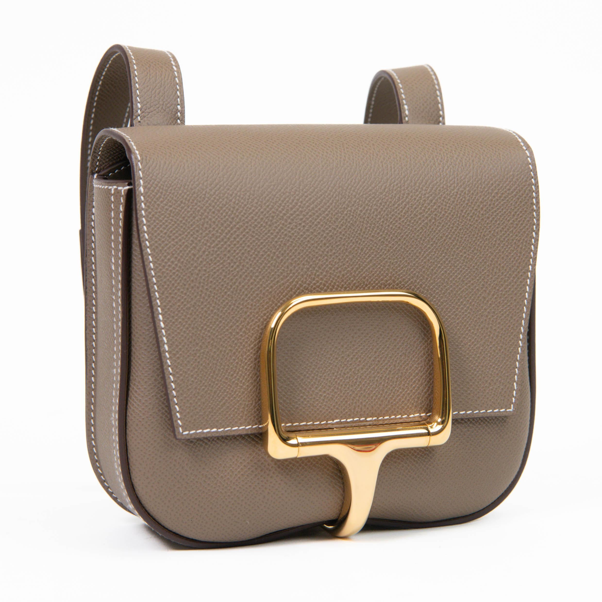 100% Authentic 

 Named after a 17th century horse riding manual, the Della Cavalleria embraces features inspired by its roots. The unique curved saddle silhouette is enhanced with a flap closure secured by a polished gold plated clasp, beautifully