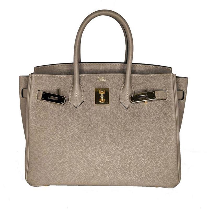 Hermès Etoupe Grey Togo Birkin 25 Handbag GHW Satchel

From the 2019 Collection. Etoupe Grey Togo Hermès Birkin 25 with gold-plated hardware, dual rolled top handles, protective feet at base, tonal Chevre interior lining, dual pockets at interior