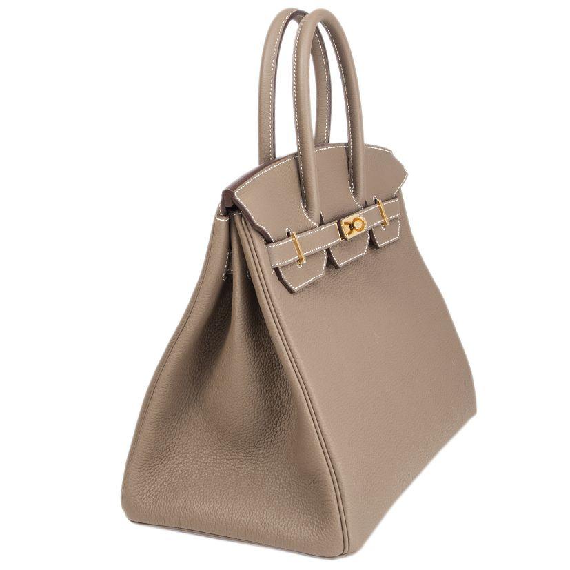Hermes 'Birkin 35' bag in Etoupe (taupe) Veau Togo leather with gold-plated hardware. Lined in Chevre (goat skin) with an open pocket against the front and a zipper pocket against the back. Brand new. Comes with keys, lock, clochette, dust bag and