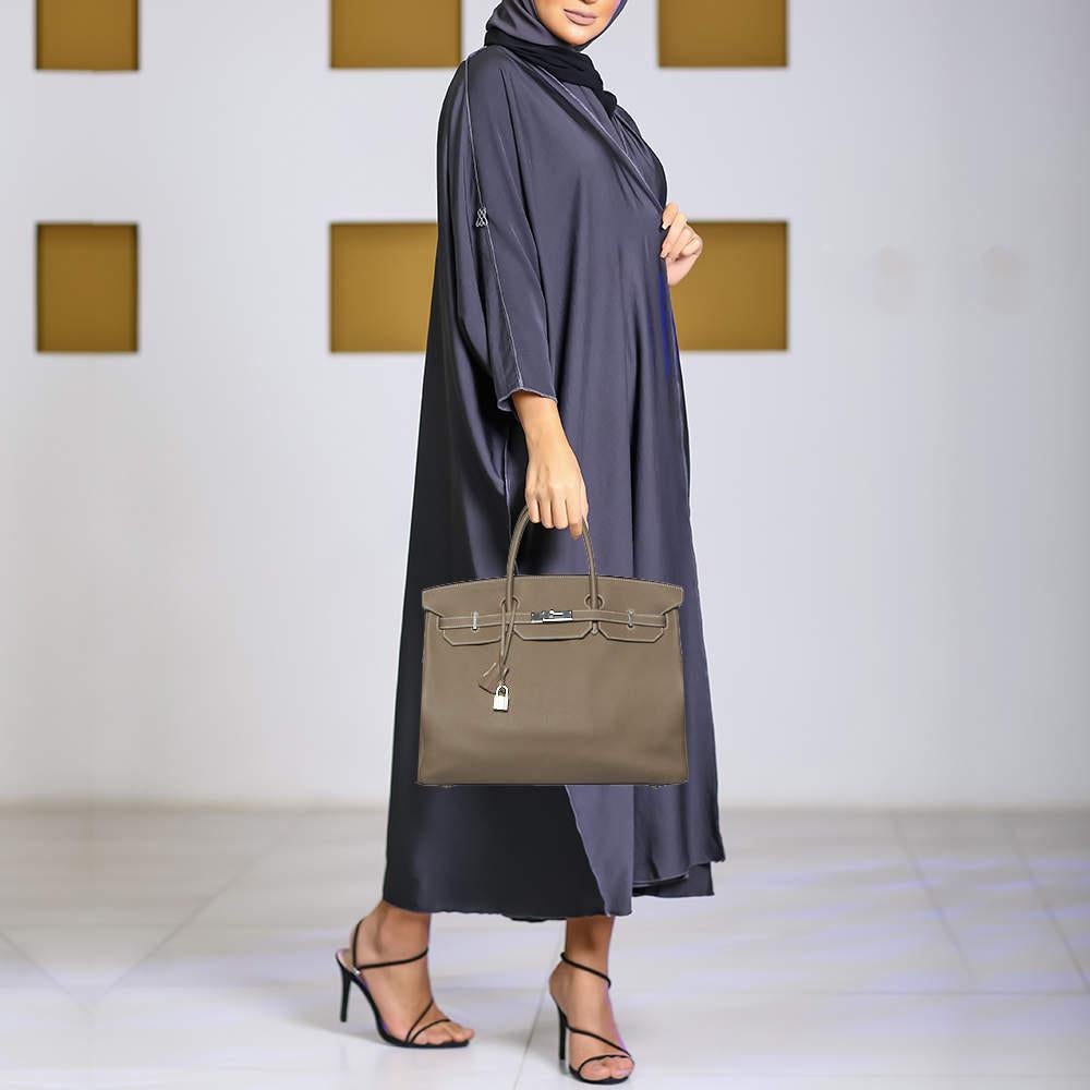 Its timeless design  rich history  impeccable construction  and limited availability have made the iconic Birkin a coveted work of art and a great investment. Were bringing the icon to you with this Etoupe grey Birkin 40. Made in France  it is sewn