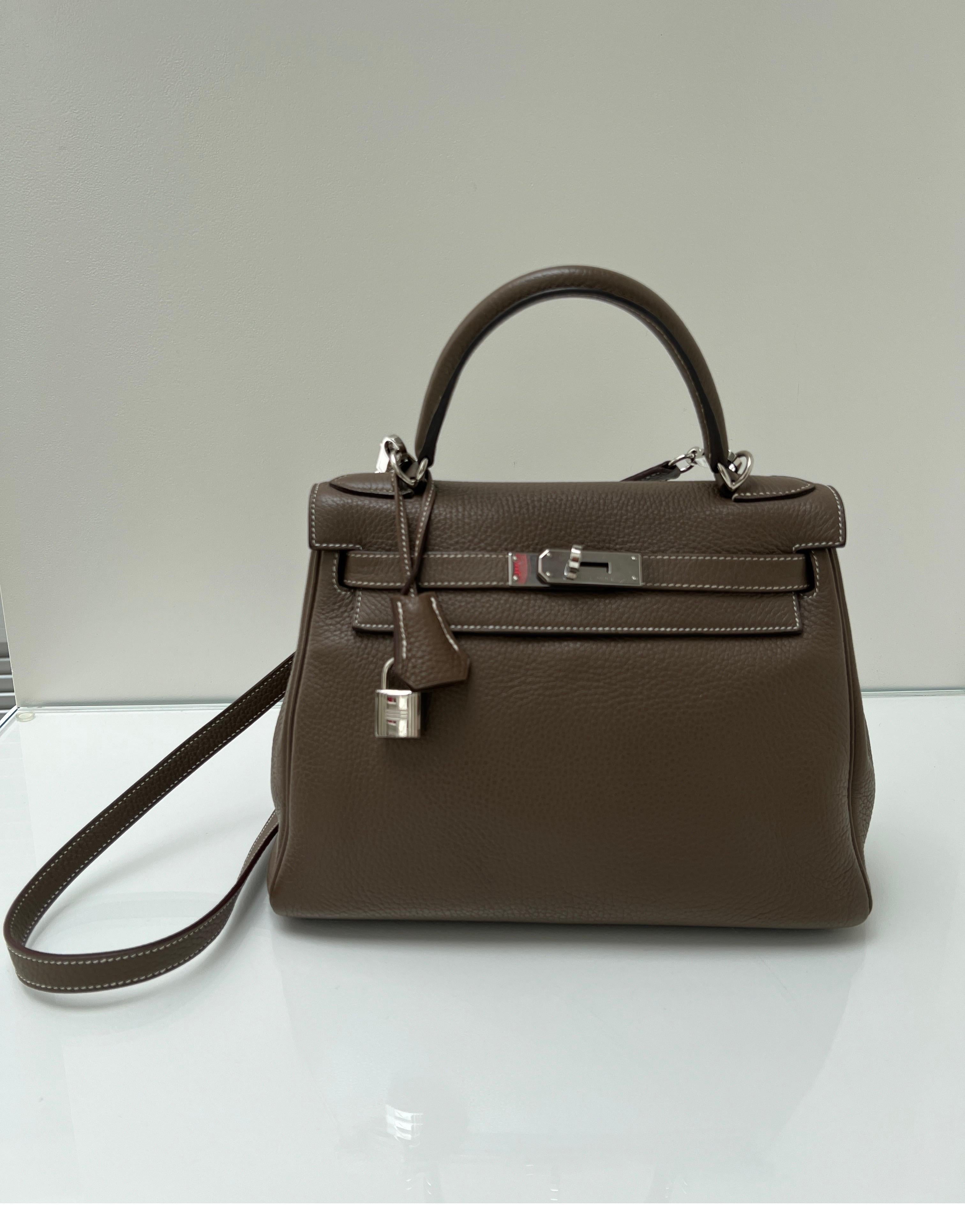 Hermes Etoupe Kelly 28 Bag. Excellent condition. Grey tan color. Palladium hardware. Interior clean. Great nuetral color. Most wanted size 28. Includes clochette, lock, keys, and dust bag. Guaranteed authentic. 