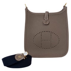 HERMES Etoupe taupe Clemence leather 
Indigo EVELYNE 16 TPM Crossbody Bag
