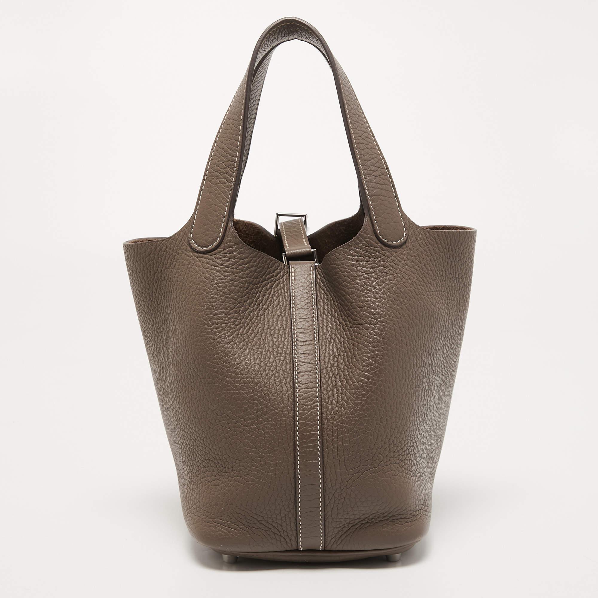 Wonderfully crafted from Taurillon Clemence leather, this Picotin from Hermes is a creation for people who love a perfect blend of luxury and style. It comes in a classy shade, and it sits in a relaxed shape with two handles and a well-sized