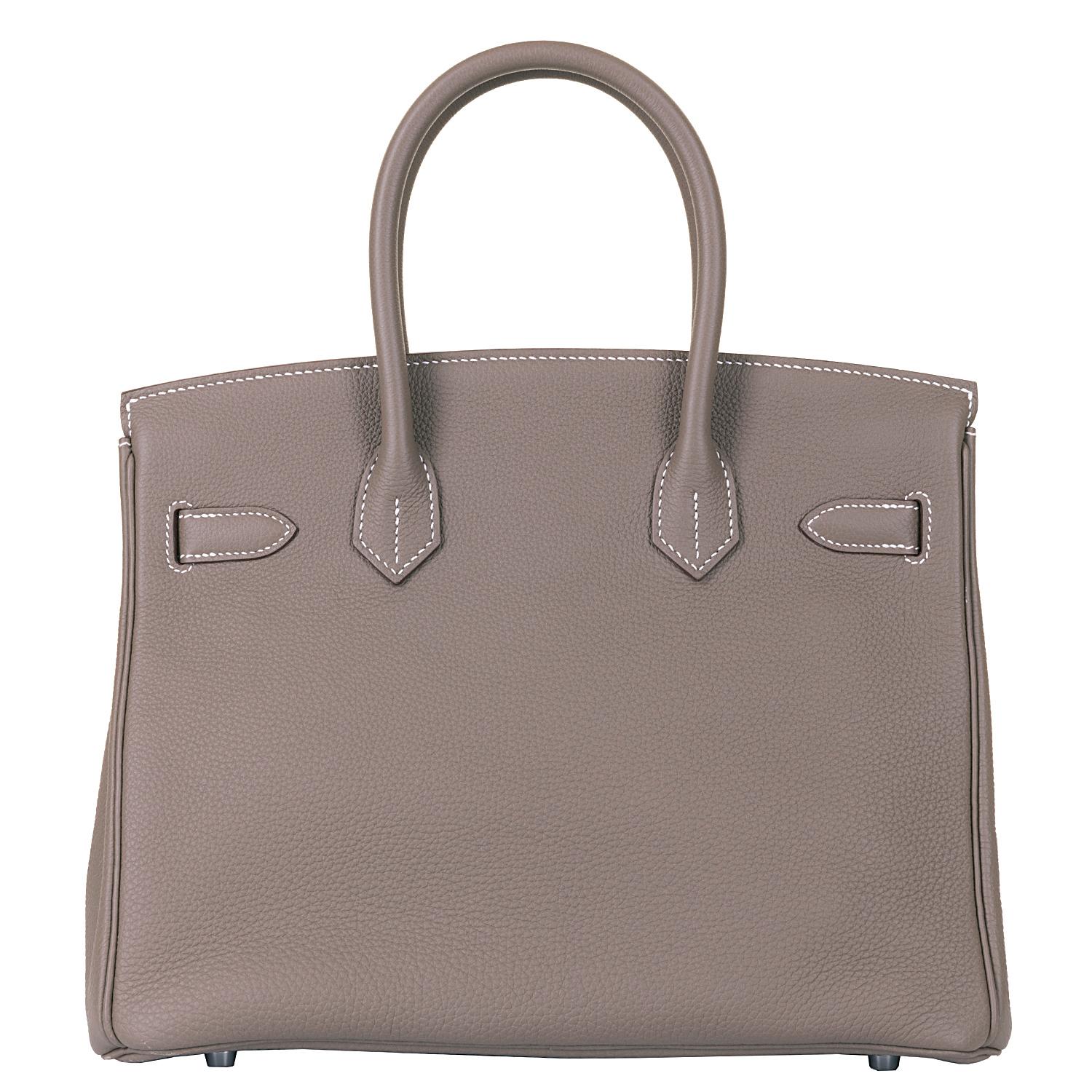 This fabulous Hermes Birkin 30 Bag is finished in 'Etoupe' Togo leather, accented with Palladium hardware. Togo is the most popular Hermes leather for Birkin bags, with its grained textured finish, it is both anti-scratch and lightweight, yet always