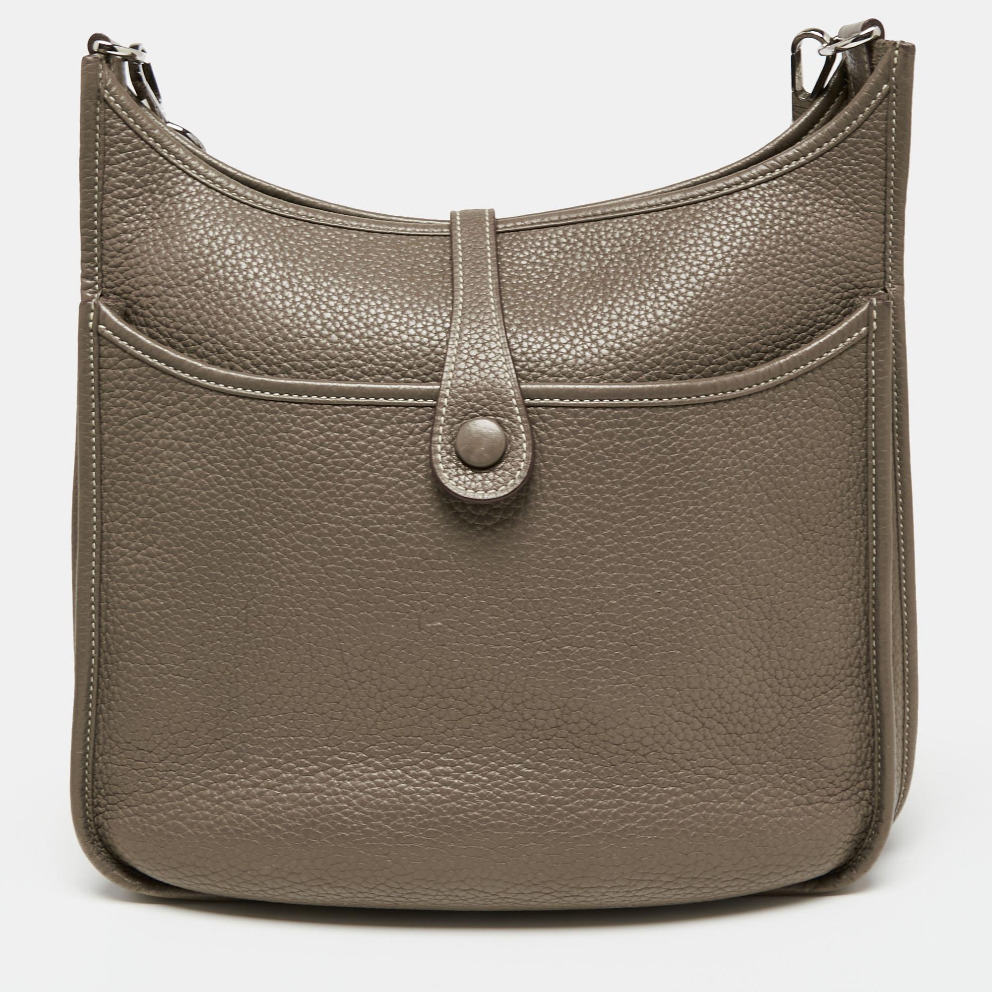 The Evelyne III is another investment-worthy bag from Hermès. This one here in the PM size is crafted from Togo leather and detailed with the signature elements of the leather tab closure, the saddle-like shape, and the perforated H on the front.