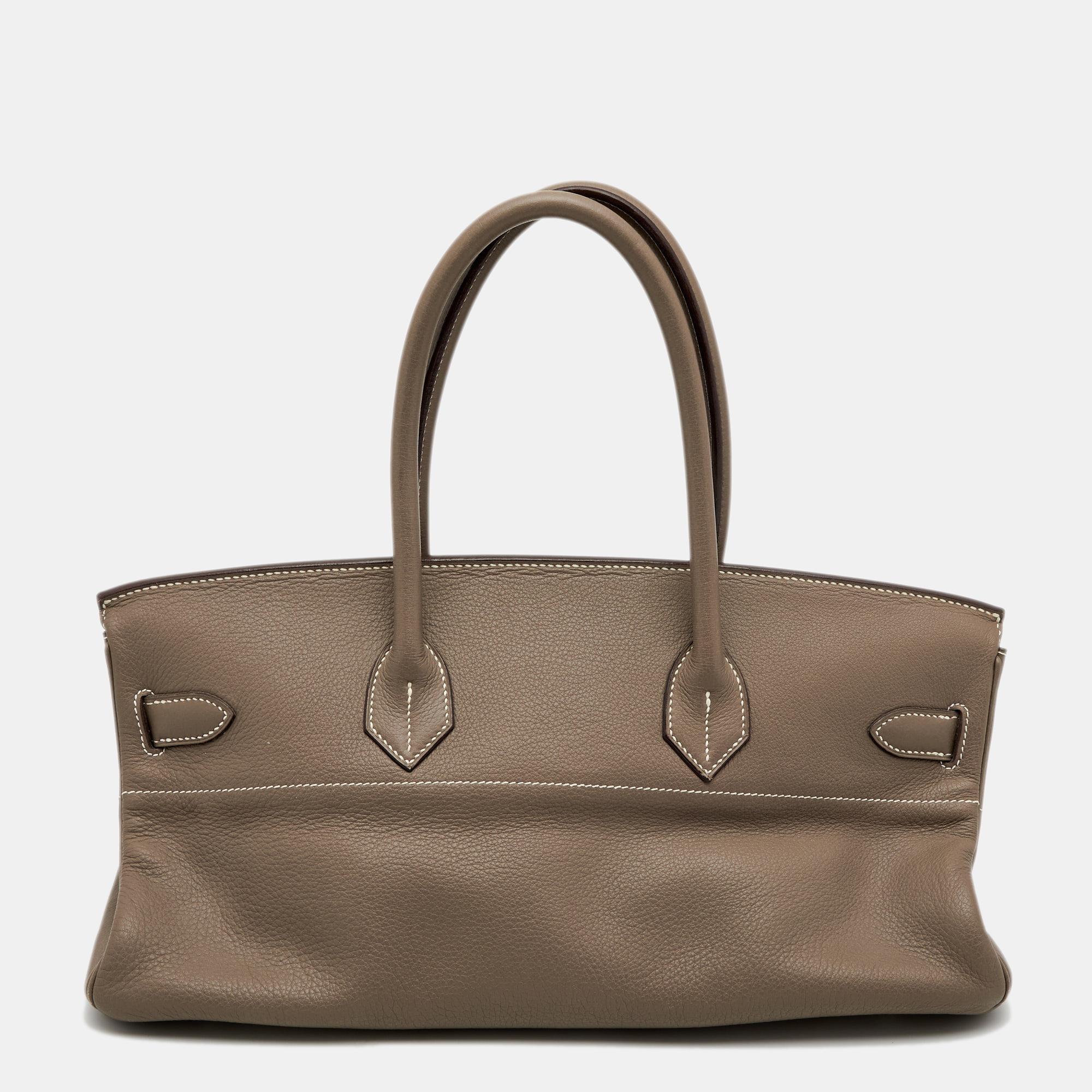 The Hermes Birkin JPG 42 will make a standout addition to your collection. The bag is crafted from Etoupe Togo leather and has palladium-plated hardware. It has a spacious size and flawless finish. Invest in this masterpiece and let it be your