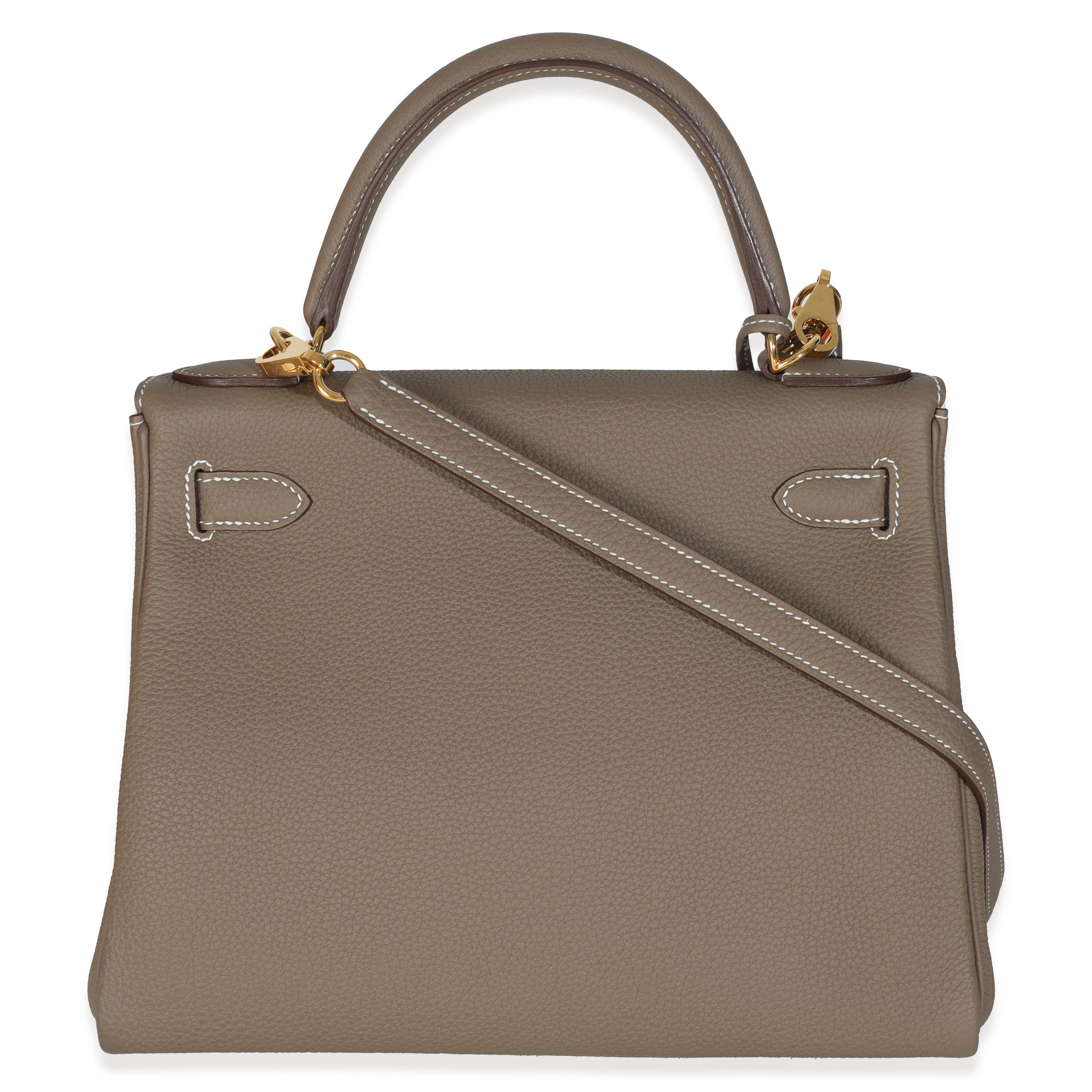 Hermès Etoupe Togo Retourne Kelly 28 GHW
SKU: Z147332

Condition Description: Officially renamed in 1977, the Kelly tote bag from Hermès was originally called the Sac à Dépêches (which translates as ‘the dispatch bag’). The structured bag’s moniker