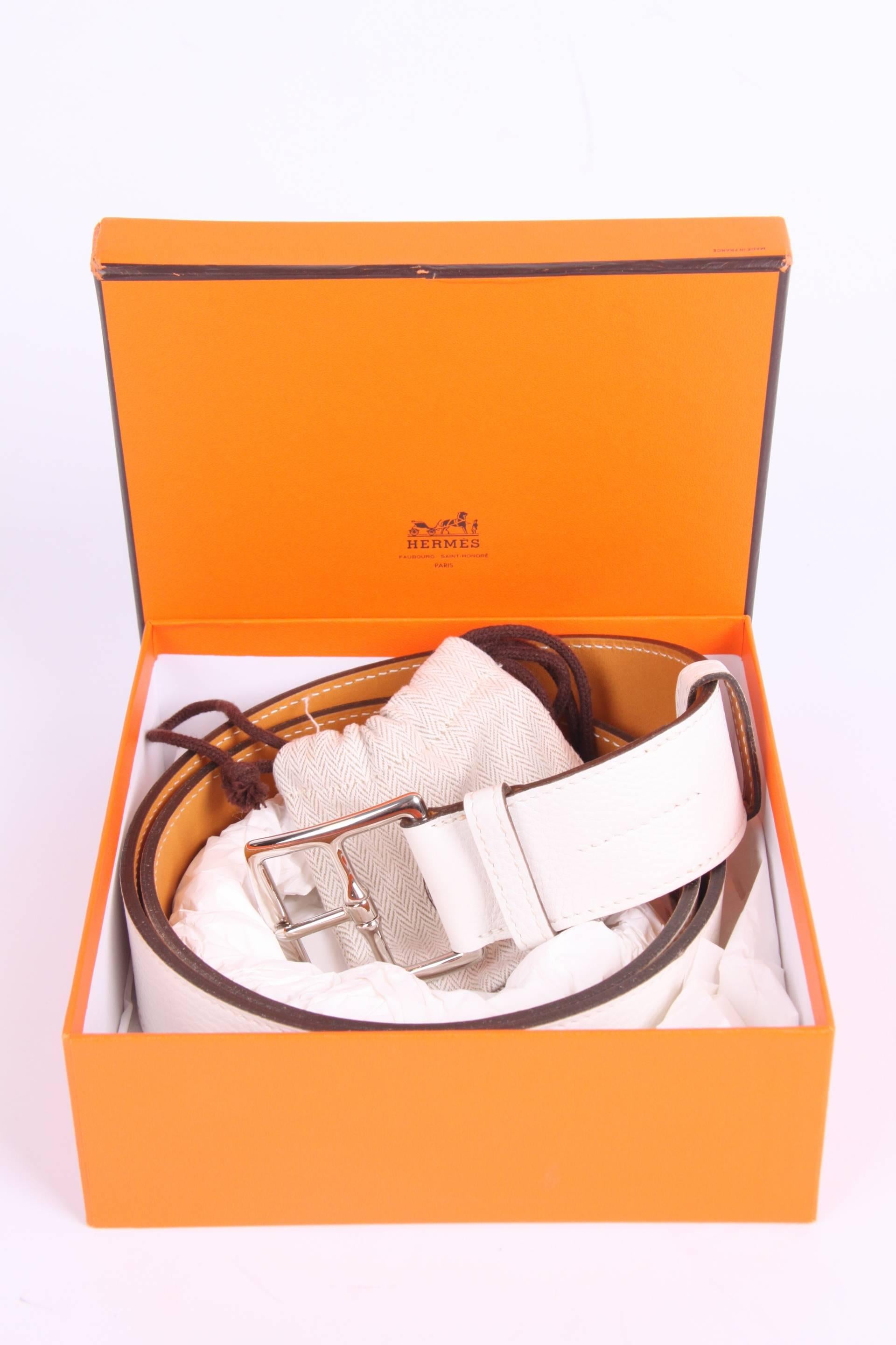 This belt has a beautiful name; it is the Hermès Etrivière Taurillon Clemence belt in white calfskin leather. And it is unisex.

Brand new item, comes with a little orange Hermès box and dustbag for the buckle. The buckle is crafted in silver-tone