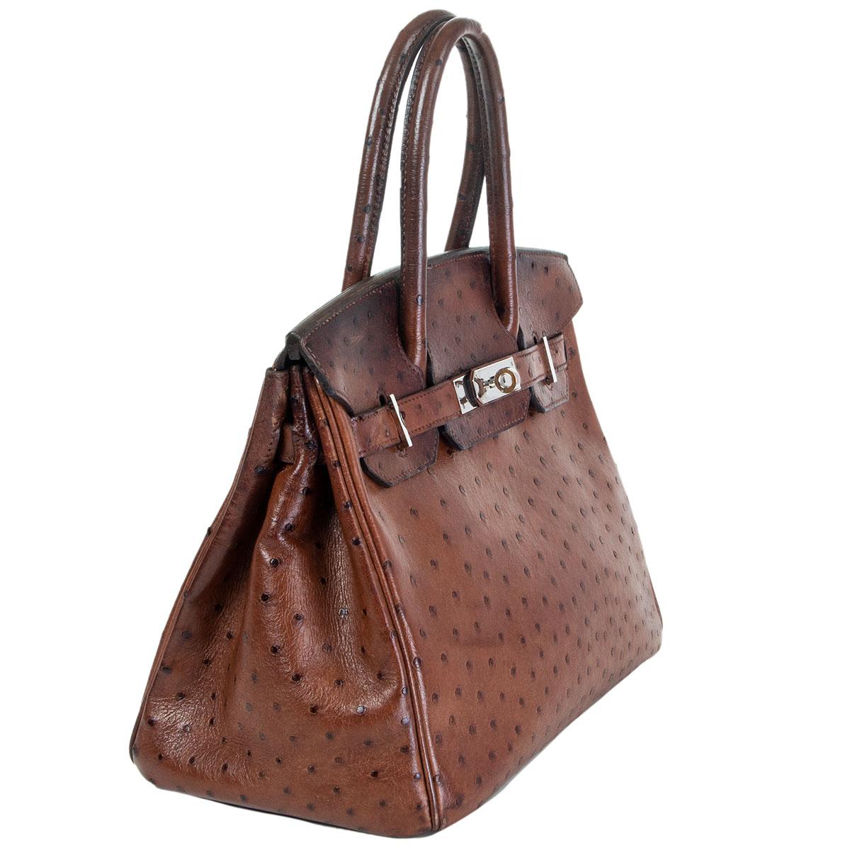 authentic Hermès Birkin 30 bag in Etrusque brown ostrich leather. Lined in brown chevre (goat skin) with an open pocket against the front and a zipper pocket against the back. Has been carried with patina allover, especially on the top part, back