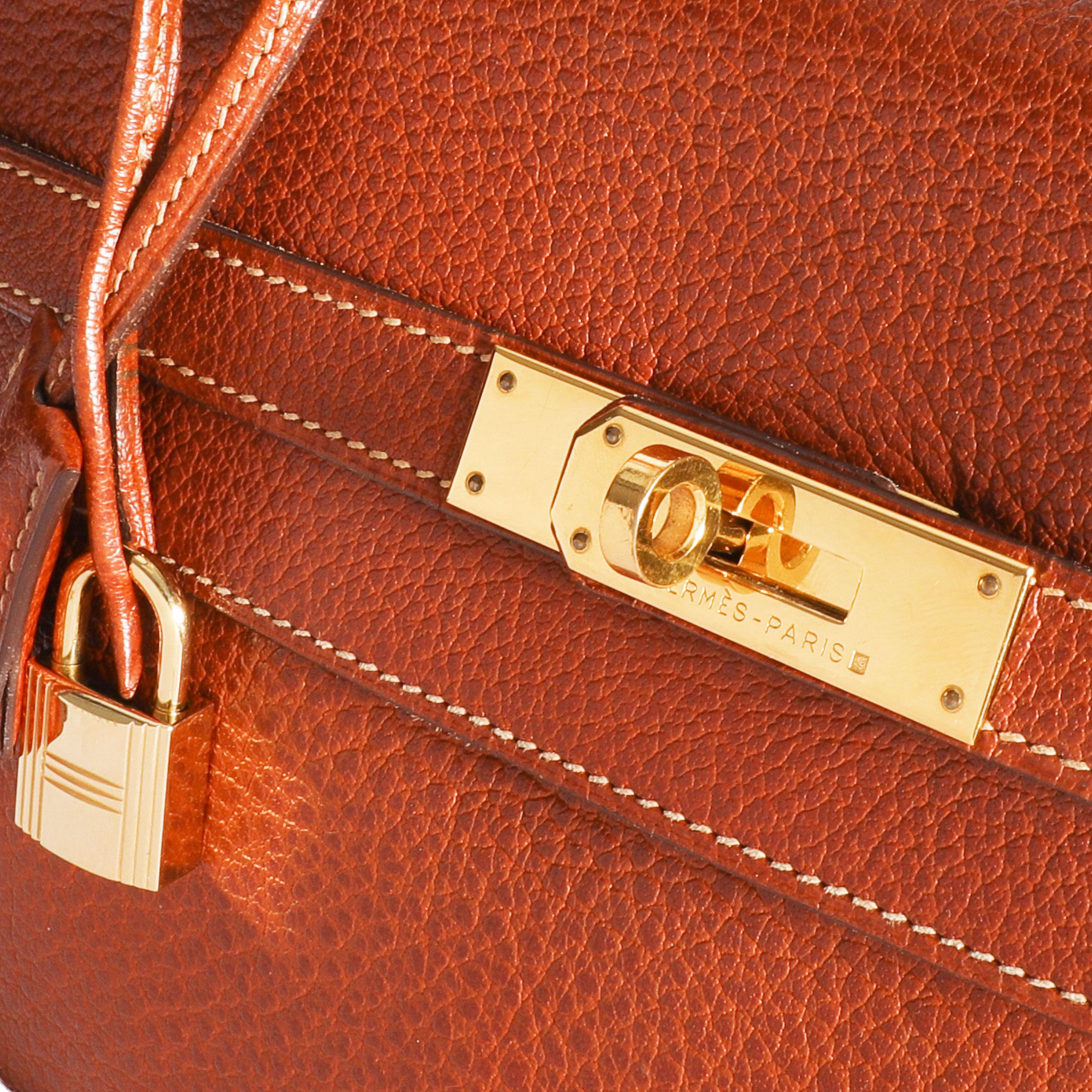 Hermès Etrusque Buffalo Leather Retourne Kelly 35 GHW

SKU: 109552

Handbag Condition: Very Good
Condition Comments: Very Good Condition. Light scuffing to corners. Scratching to hardware. Faint scuffing to interior.

Brand: Hermès
Model: