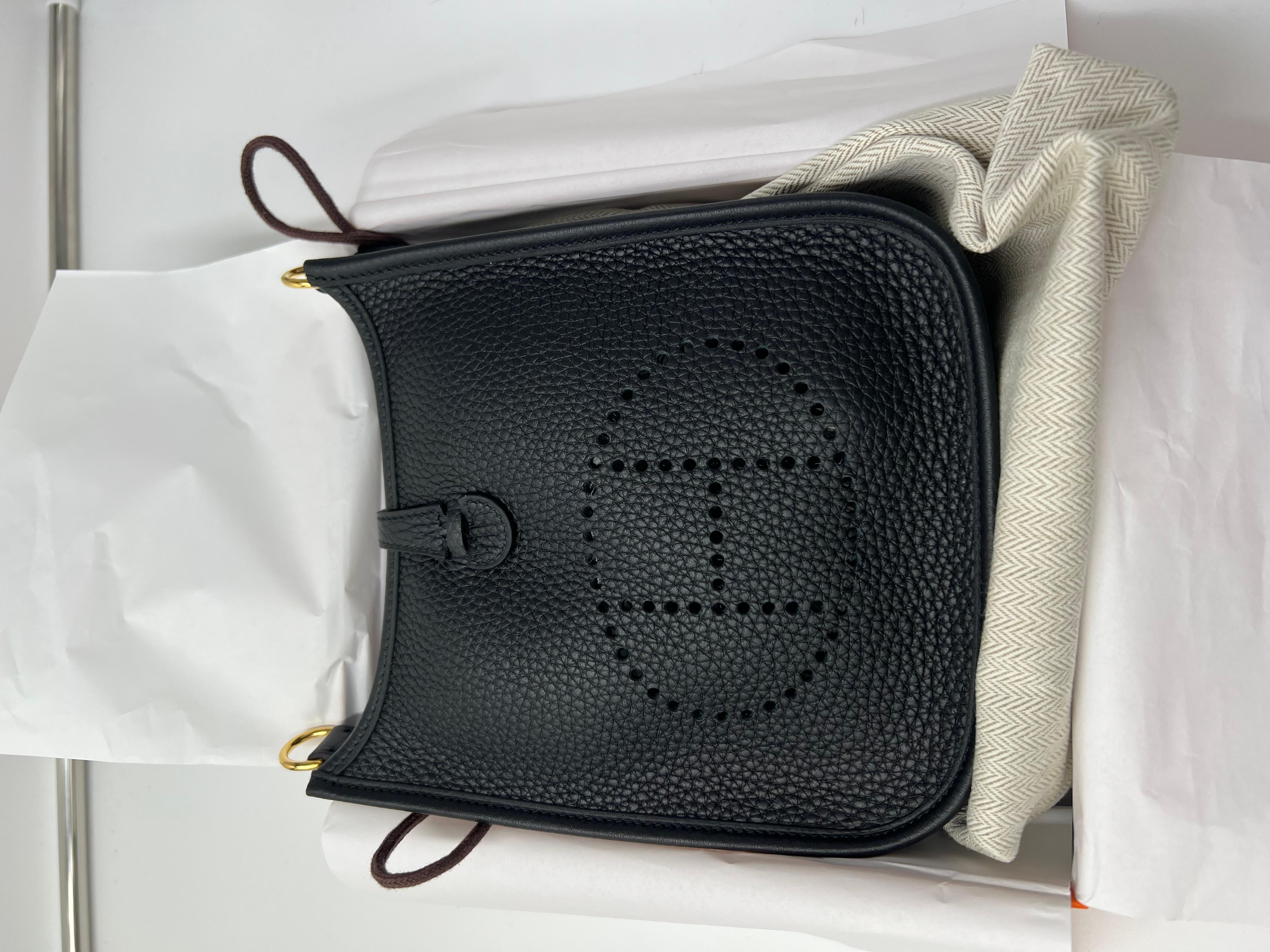 Hermes mini Evelyne 18 black togo bag with black strap and gold hardware. Comes full set