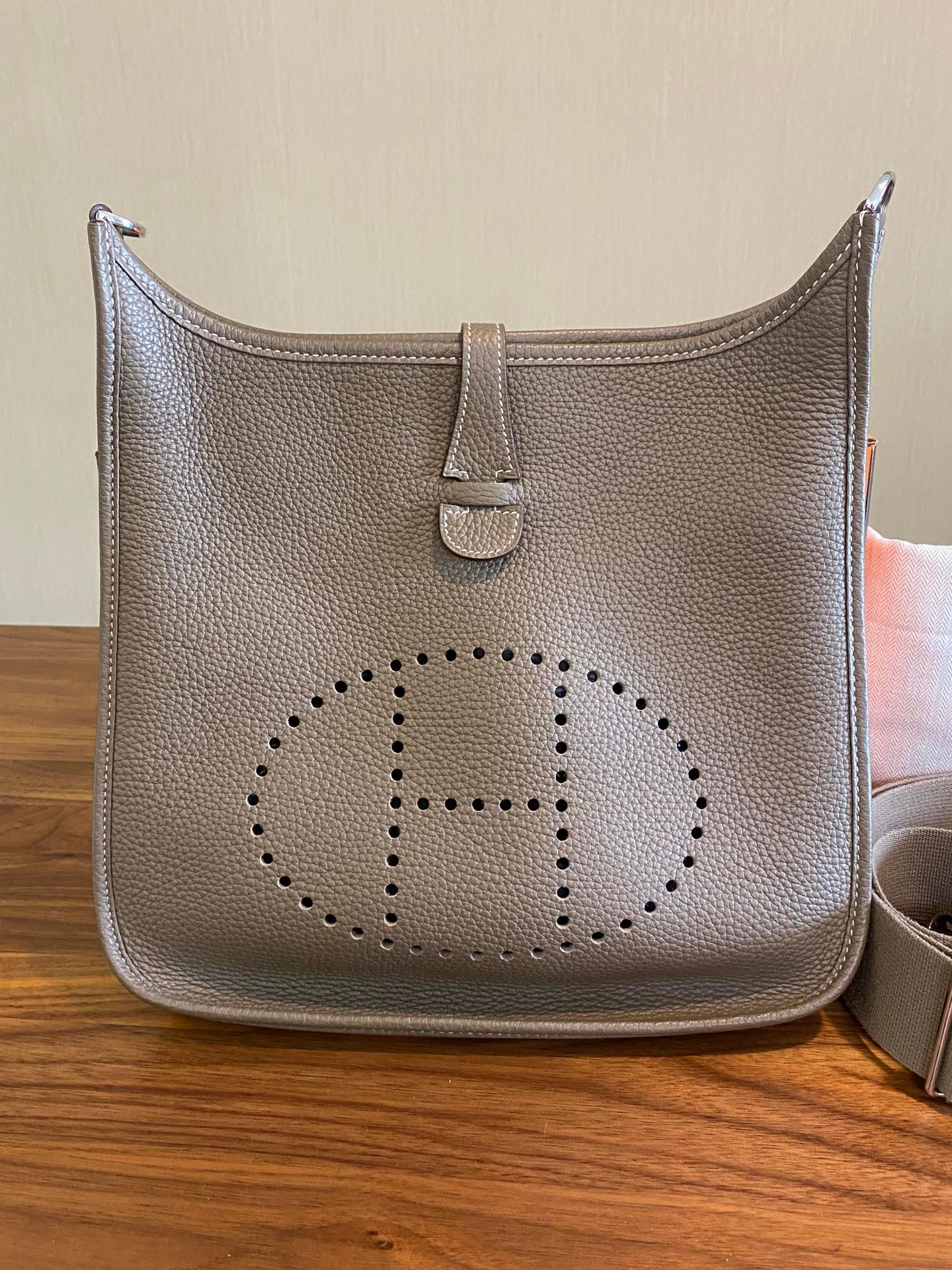 Hermes Evelyne 29 Large Crossbody Bag Grey with Strap
 These are professional photos of the actual bag offered by Luxbags.
 The Hermes Evelyne 29 Large Crossbody Bag offers a minimalist silhouette and lightweight design, providing freedom for both