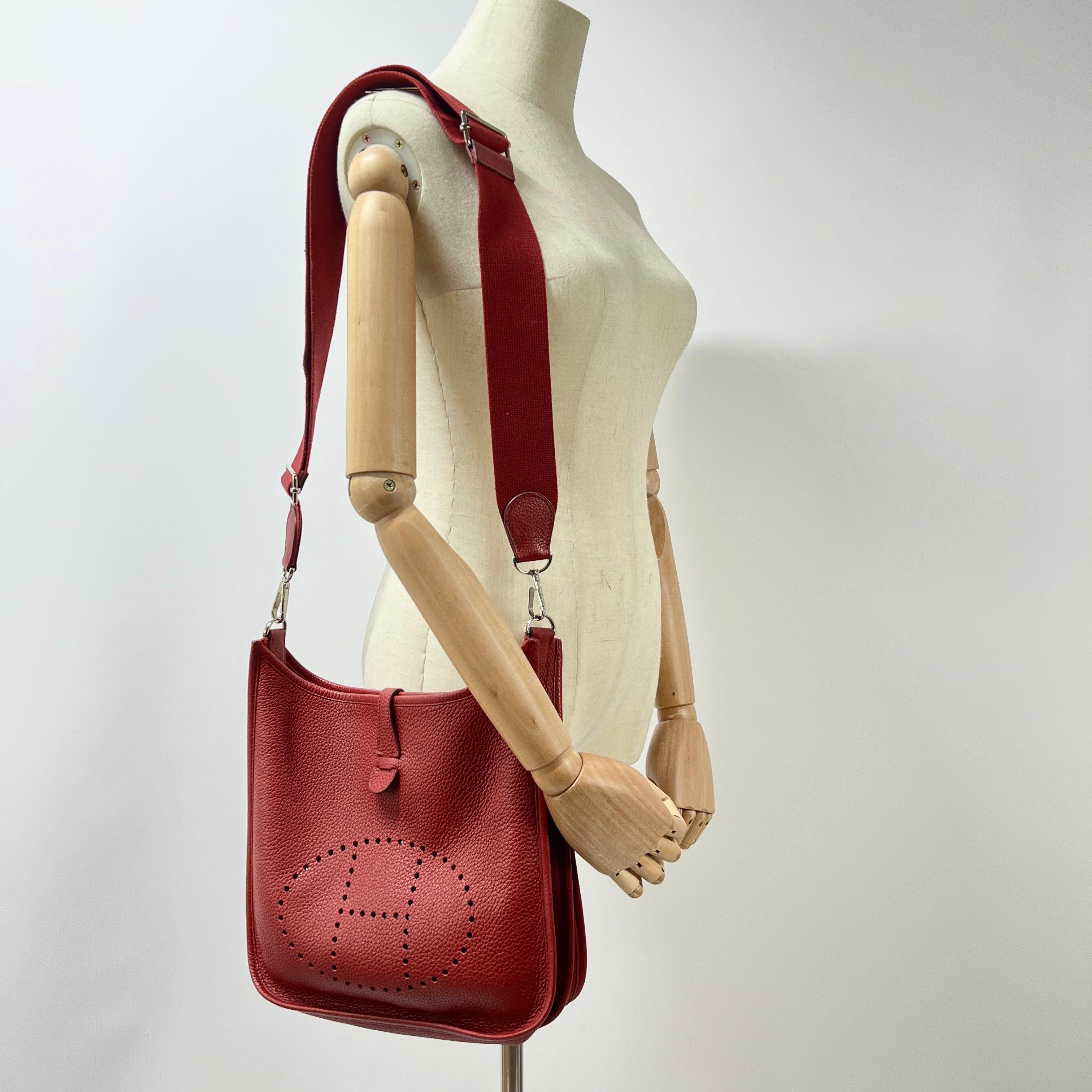 Magnificent Hermès Evelyne III in Clemence leather, red with palladium hardware. Snap-tab closure, perforated “H”, main compartment and exterior slip pocket.
Date code ☐Q (2013), made in France.
Includes box and dustbag.
The bag is in very good