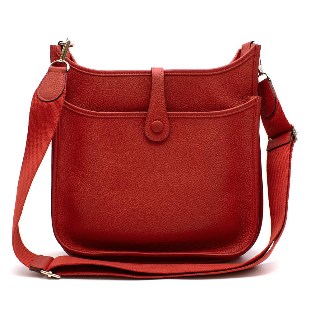 Hermès Evelyne III PM Bag in Vermiliion Clémence Leather with Palladium Hardware. 
2014

Includes Shoulder Strap, Dust Bag and Box. 
Size: PM

26.5cm x 28cm x 7cm 