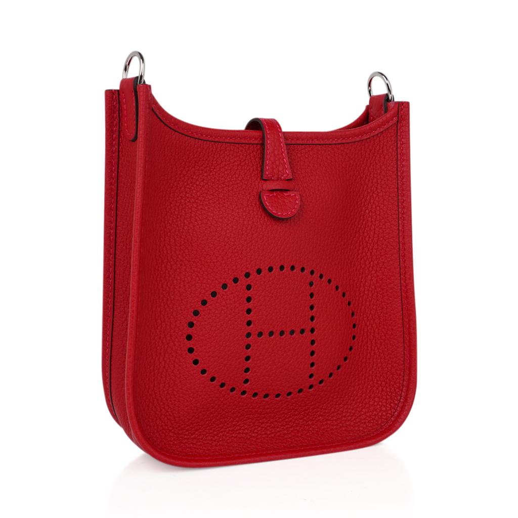 Mightychic offers a guaranteed authentic Hermes Evelyn TPM bag featured in coveted lipstick red Rouge Casaque.
Clemence leather is soft and scratch resistant.
Fresh with palladium hardware.
Signature perforated H on front of bag.
Sport strap in