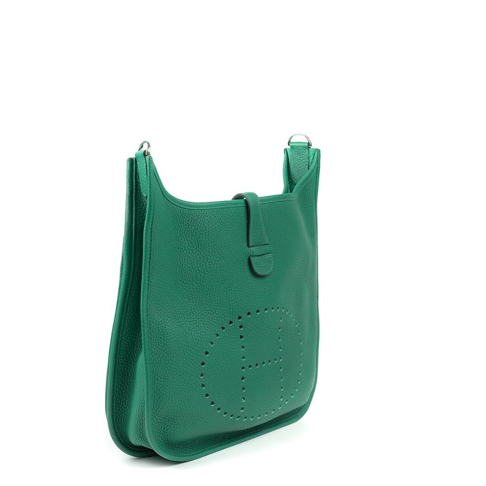 - Designer: HERMÈS
- Model: Evelyne
- Condition: Very good condition. Interior stains
- Accessories: Dustbag
- Measurements: Width: 28cm, Height: 27cm, Depth: 7cm, Strap: 95cm
- Exterior Material: Leather
- Exterior Color: Green
- Interior Material: