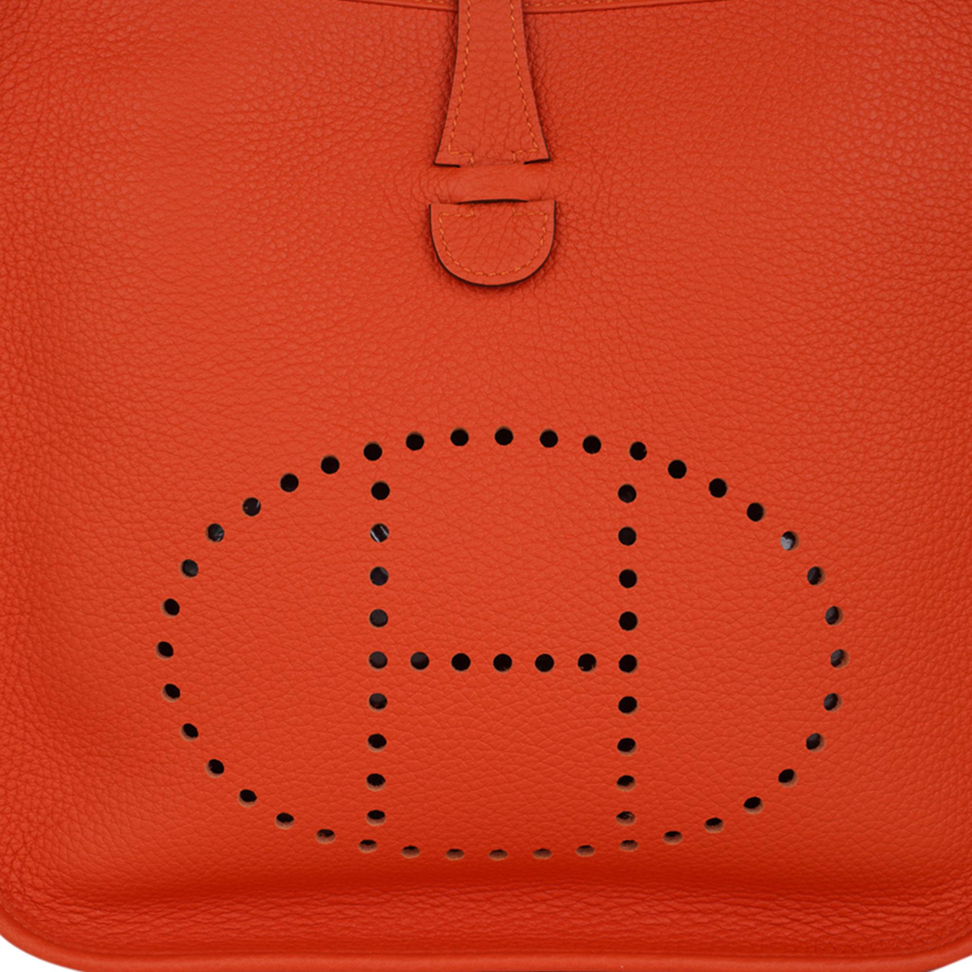 Mightychic offers an Hermes Evelyne PM featured in Feu Orange.
Beautiful with gold hardware.
Plush clemence leather.
Fabulous shoulder or cross body bag with roomy interior and rear outside deep pocket.
Signature perforated H on front of bag.
Comes