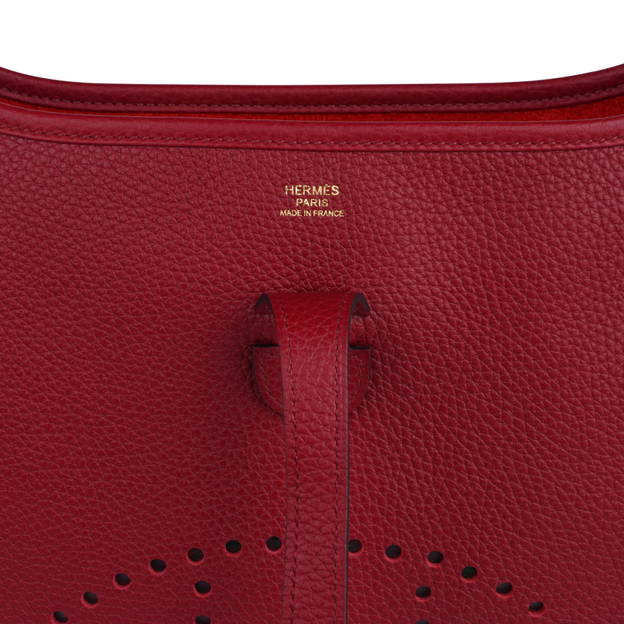 Mightychic offers a guaranteed authentic coveted PM Evelyn Hermes bag featured in rich Rouge Grenat.
Signature perforated H on front of bag.
Sport strap in textile with leather and gold hardware details.
Fabulous shoulder or crossbody bag with roomy