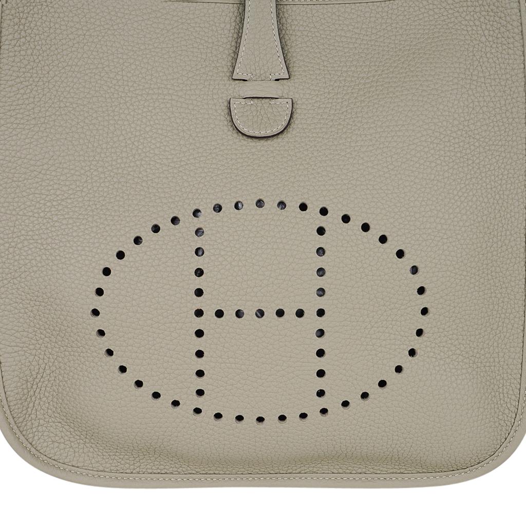 Guaranteed authentic Hermes Evelyne PM featured in Sage.
Plush Clemence leather and fresh Palladium hardware
Fabulous shoulder or cross body bag with roomy interior and rear outside deep pocket.
Signature perforated H on front of bag.
Comes with