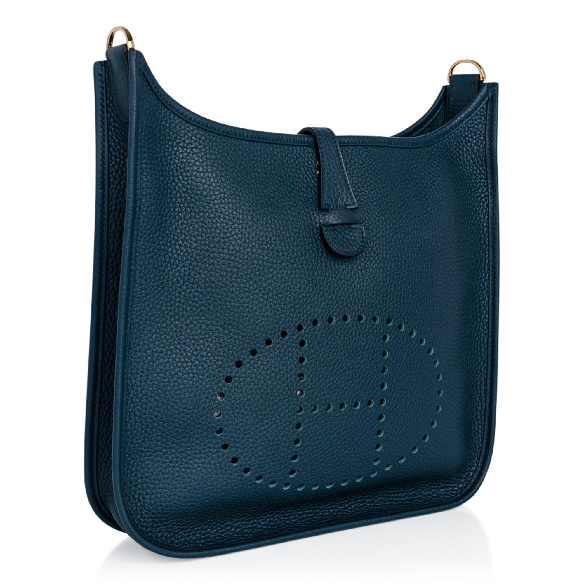 Guaranteed authentic Hermes Evelyne PM featured in lush Vert Cypress.
Rich with gold hardware.
Plush clemence leather.
Fabulous shoulder or crossbody bag with roomy interior and rear outside deep pocket. 
Sport strap in textile with leather and