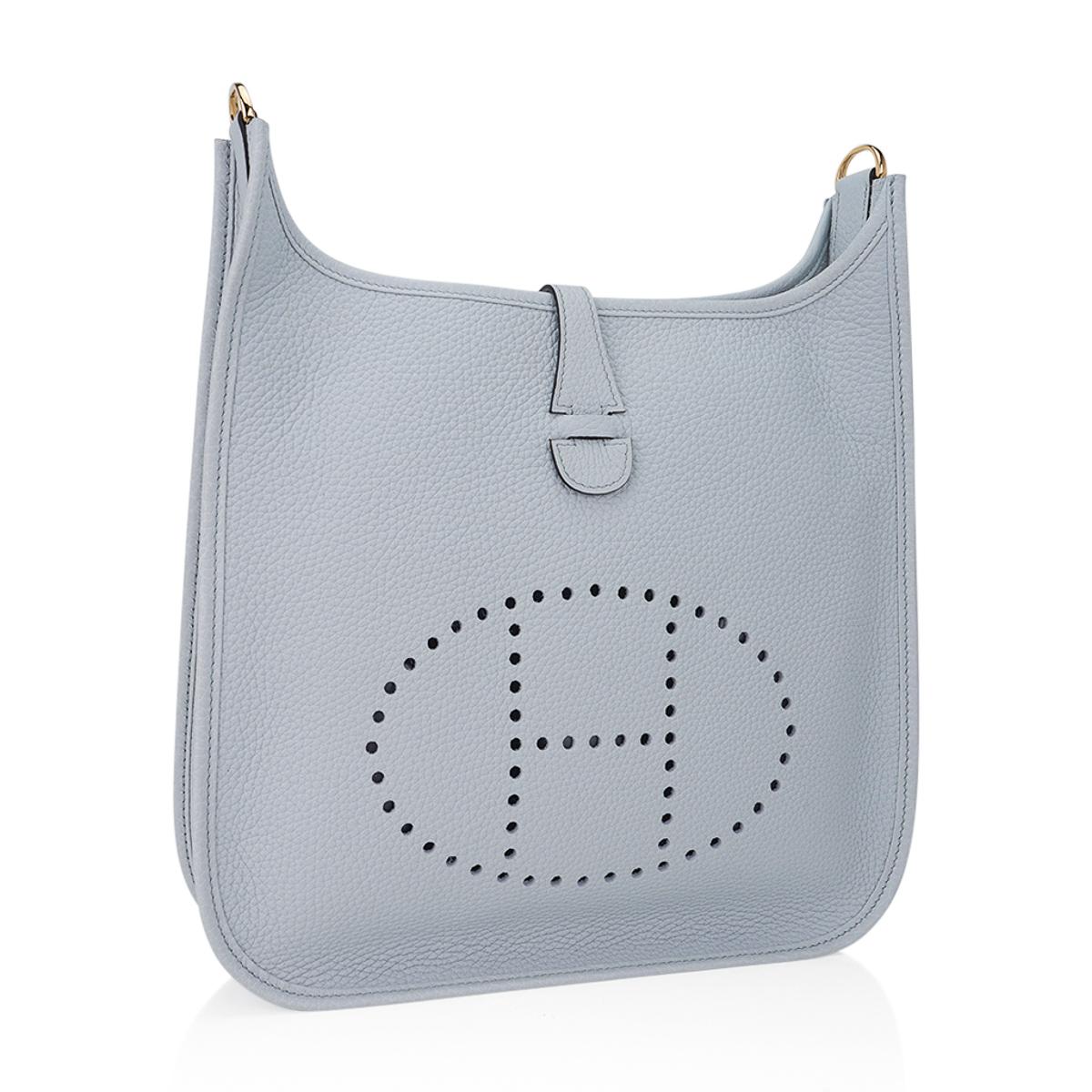 Mightychic offers an Hermes Evelyne PM featured in gorgeous Blue Pale.
Accentuated with Gold hardware.
Plush clemence leather.
Fabulous shoulder or cross body bag with roomy interior and rear outside deep pocket.
Sport strap in textile with leather