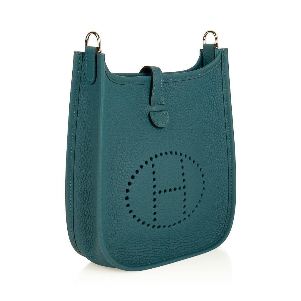 Guaranteed authentic Hermes TPM Evleyne features new rich Vert Vert Bosphore.
Fresh with palladium hardware.
Clemence leather is soft and scratch resistant.
Signature perforated H on front of bag.
Fabulous shoulder or cross body bag. 
Canvas with