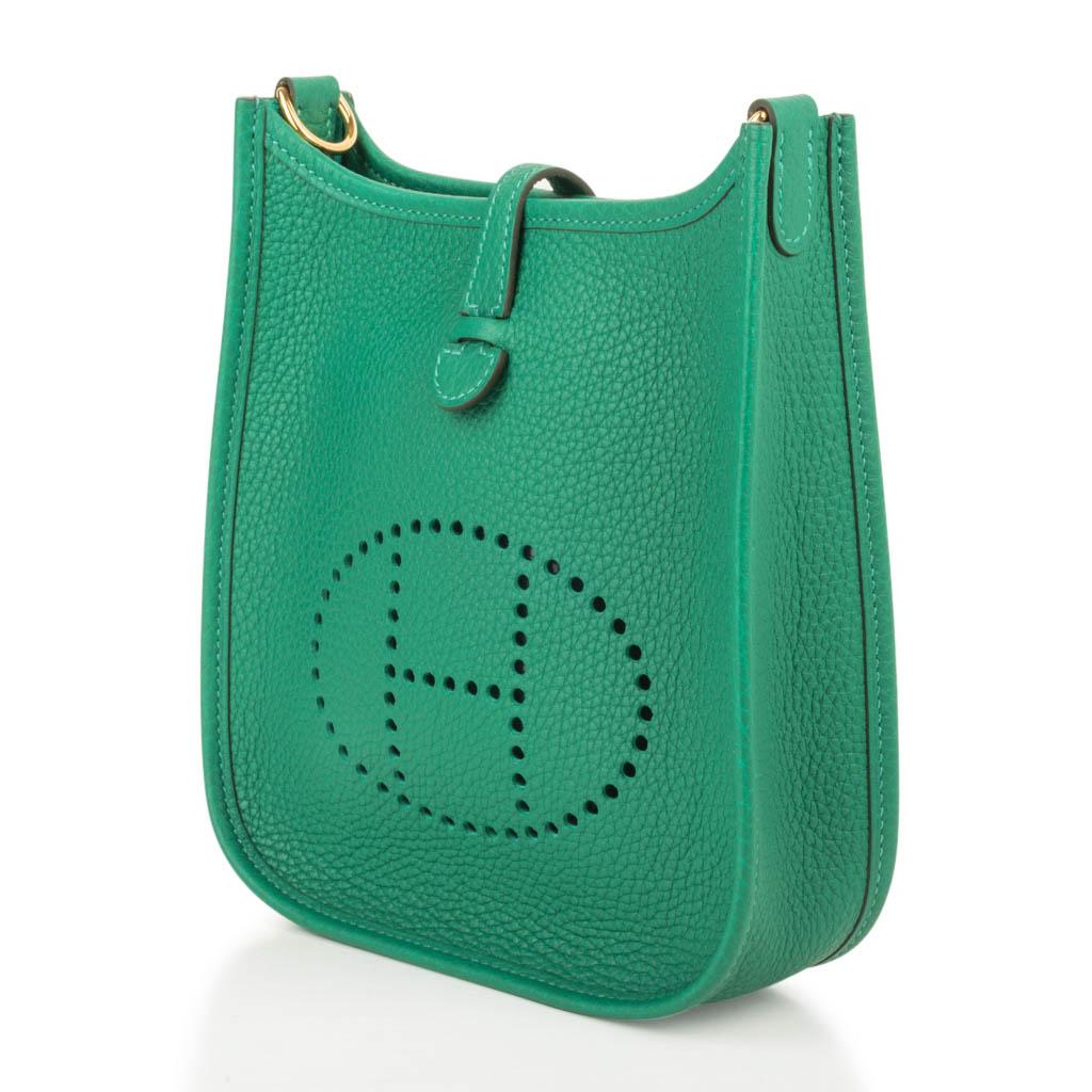 Guaranteed authentic Evelyne TPM bag features fresh green Vert Vertigo.  
Clemence leather is soft and scratch resistant.
Signature perforated H on front of bag.
Lush with Gold hardware.
Fabulous shoulder or cross body bag. 
Sport strap in textile