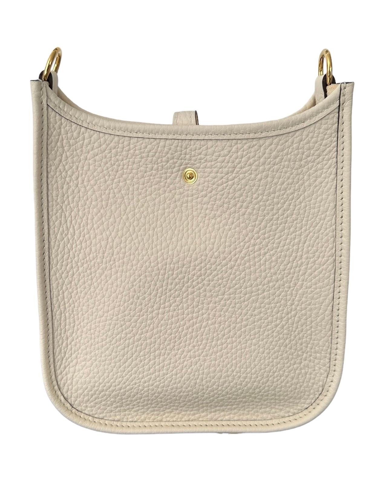 Hermes Evelyne Tpm 16
We have it in stock, ready, store fresh

This is the mini, the smallest size they make
Think spring summer
One of the prettiest colors
NATA, A CREAMY WHITE
Nata Strap

Collection 
Natural  interior
Gold  plated hardware
Hermes