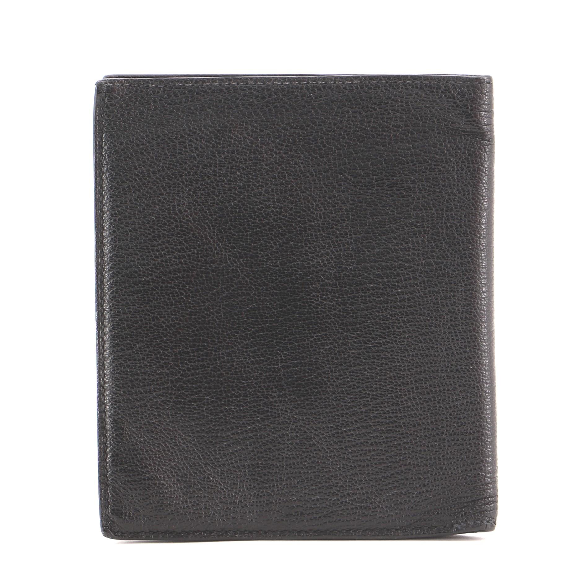 Hermes Evelyne Wallet Chevre Mysore Compact
Black Chevre Mysore

Condition Details: Moderate wear, creasing and indentations on exterior and in interior, heavy splitting on base and opening corner wax edges.

49783MSC

Height 5