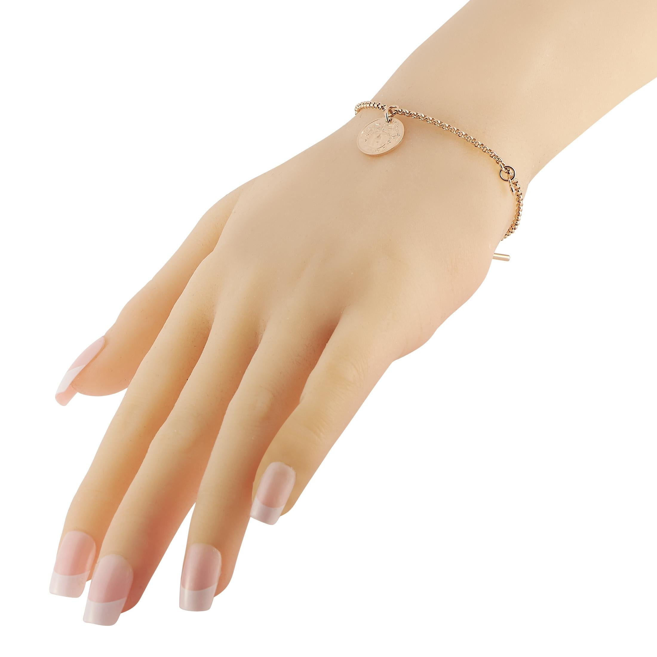 This 18K Rose Gold Hermes Ex-Libris bracelet is an elevated take on a classic charm bracelet. Circular charms adorned with the iconic Ex-Libris motif make this delicate design come to life. It measures 6.5” long and includes toggle clasp closure. 
