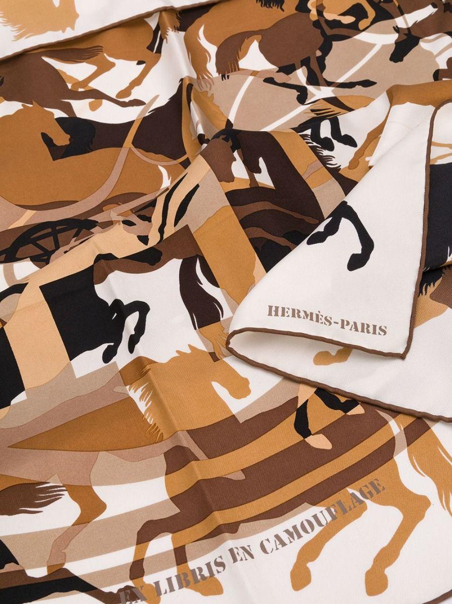 Elizabeth Taylor once said that a woman without a scarf is a woman without a future. Decorated with a horse print, this Ex Libris En Camouflage scarf from Hermès will ensure yours is a glamorous one. Effortlessly add a certain je ne sais quoi to any