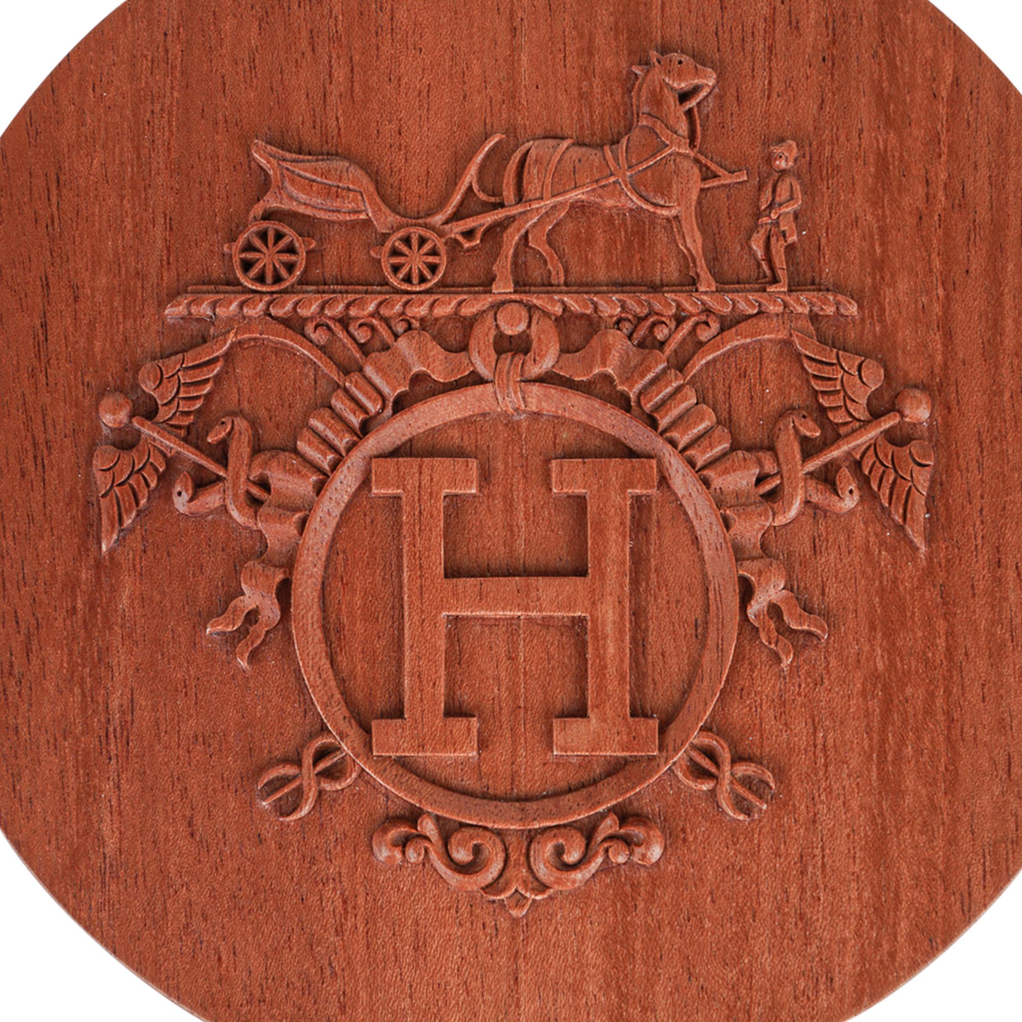 Mightychic offers a guaranteed authentic Hermes Boite Ronde Ex-Libris Twilly box.
Hand carved in rich Mahogany wood.
Exquisite display piece in any room.
Use for your twillies, or to keep your mementos in secret!
New or Pristine Store Fresh