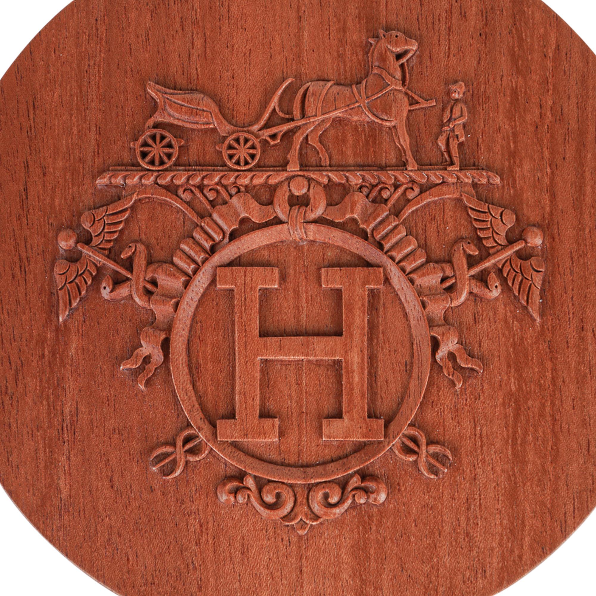 Mightychic offers a guaranteed authentic Hermes Boite Ronde Ex-Libris Twilly box.
Hand carved in rich Mahogany wood.
Exquisite display piece in any room.
Use for your twillies, or to keep your mementos in secret!
New or Pristine Store Fresh