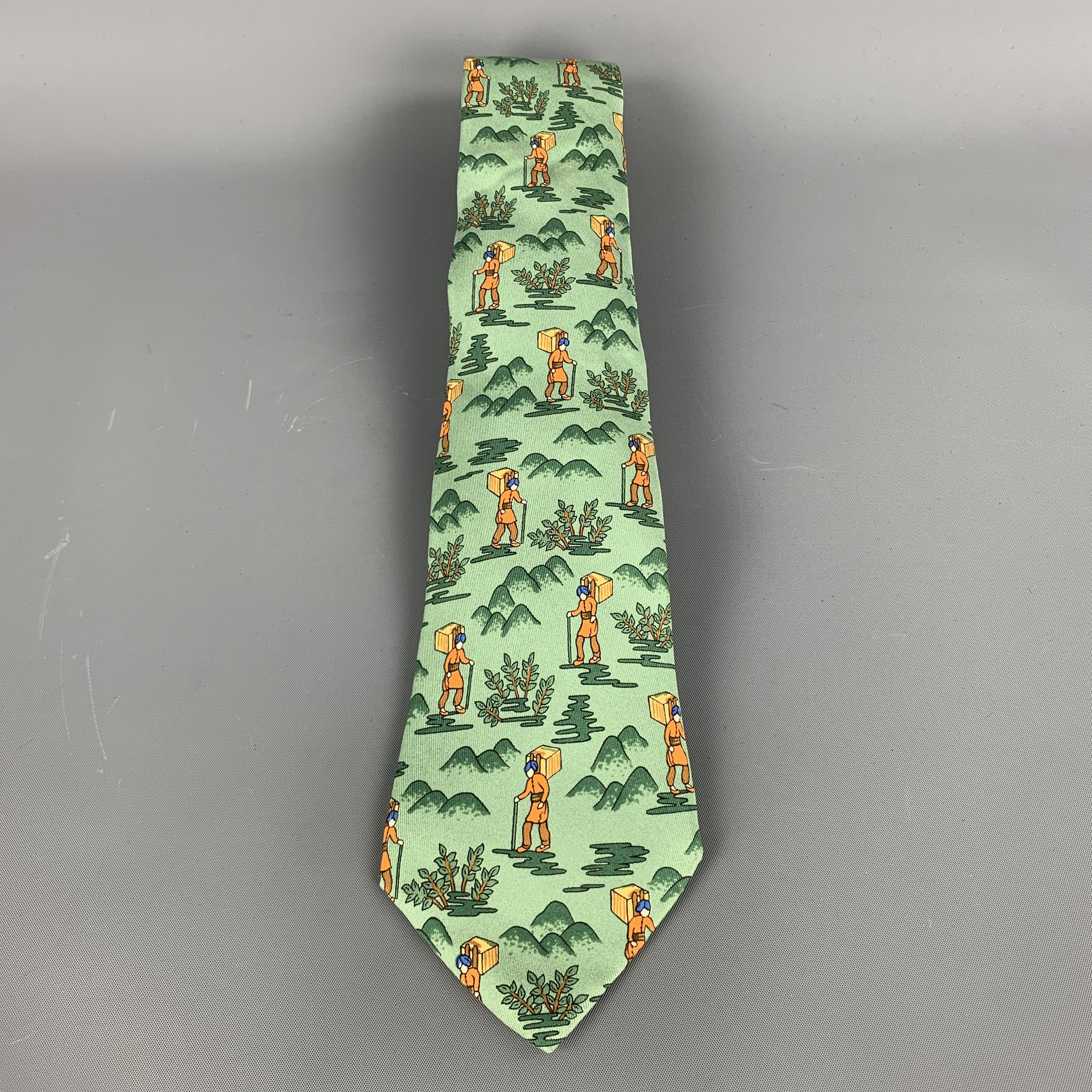 Vintage Hermes necktie comes in green silk twill with all over 