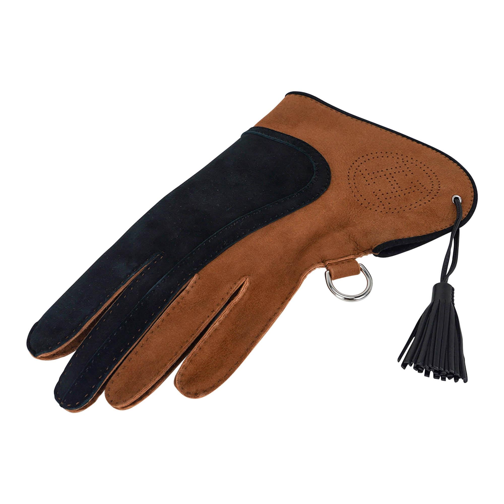 Mightychic offers an Hermes left hand rare Falconry Glove featured in Gold and Black.
Beautifully crafted in lambskin suede.
Palladium plated D ring.
Black lambskin tassel.
NEW or NEVER WORN.
final sale

GLOVE SIZE: 9

GLOVE MEASURES:
12.5