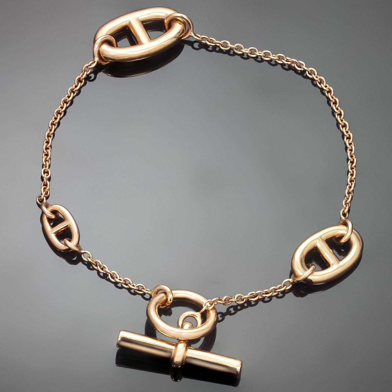 This chic Hermes bracelet from the Farandole collection features a chain and oval link design crafted in 18k rose gold and completed with a toggle closure. Made in France circa 2010s. . 