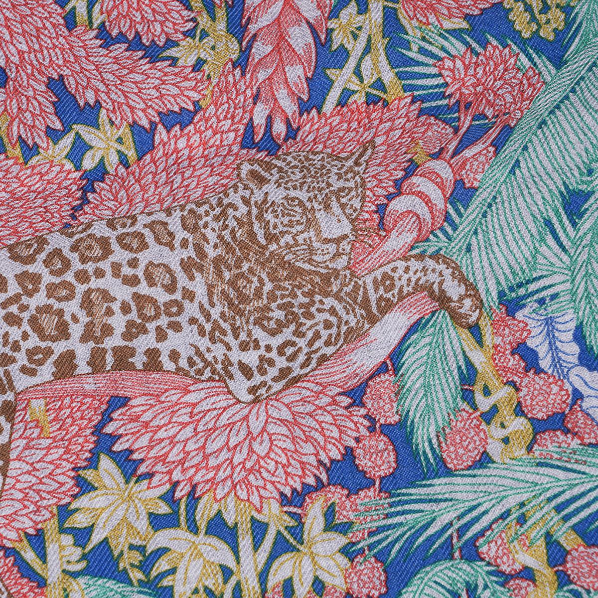 Mightychic offers an Hermes Faubourg Tropical Cashmere and Silk scarf by Octave Marsal
and Theo Gueltzl.
Featured in Bleu, Vert and Gris colorway.
This Hermes Cashmere and silk shawl is set with a wonderful tropical jungle filled with marvelous