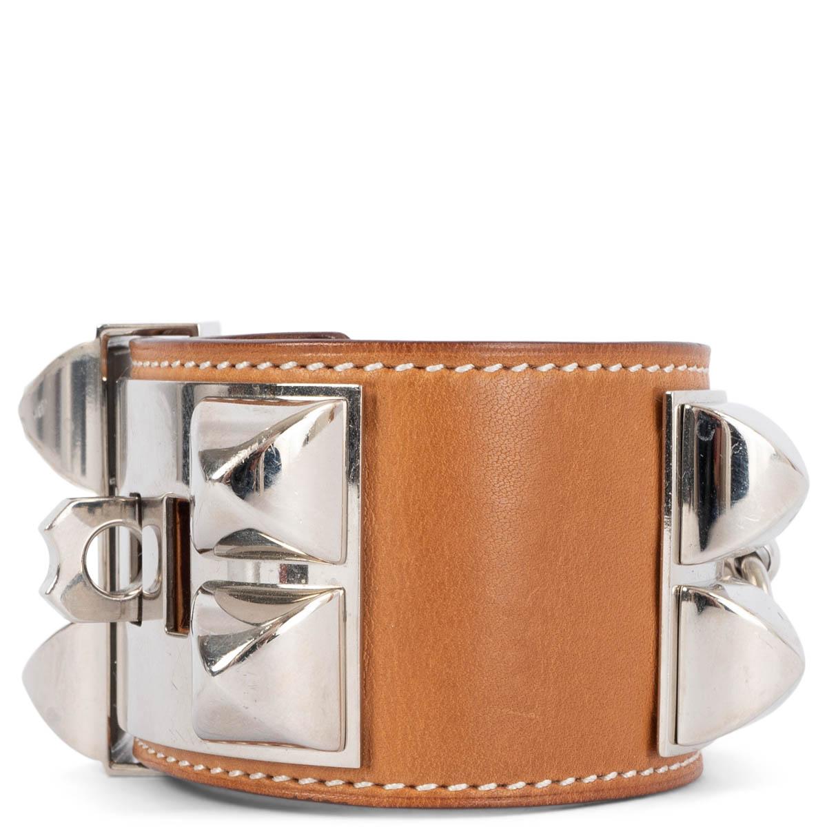 100% authentic Hermès Collier de Chien bracelet in Fauve (cognac) Veau Barnia leather with Palladium hardware. Has been worn and shows an overall natural patenia to the leather and faint scratches to the hardware.

Measurements
Tag