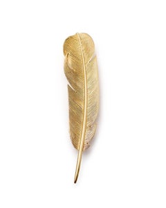 Hermes feather brooch by Georges Lenfant in 18 karats gold