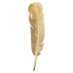 Hermes feather brooch by Georges Lenfant in 18 karats gold