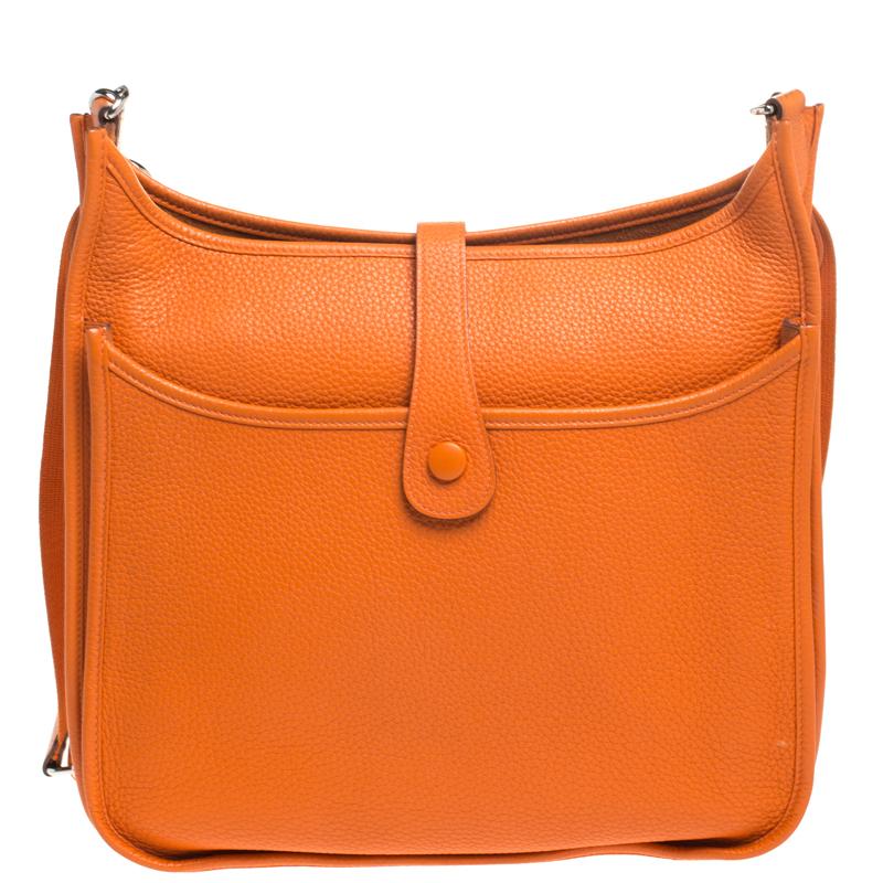 Hermes is a brand that delivers designs with art and creativity and this Evelyne is just another proof. Finely crafted from leather in a ravishing orange shade, and featuring an adjustable shoulder strap, this piece is a classic. The bag is spacious