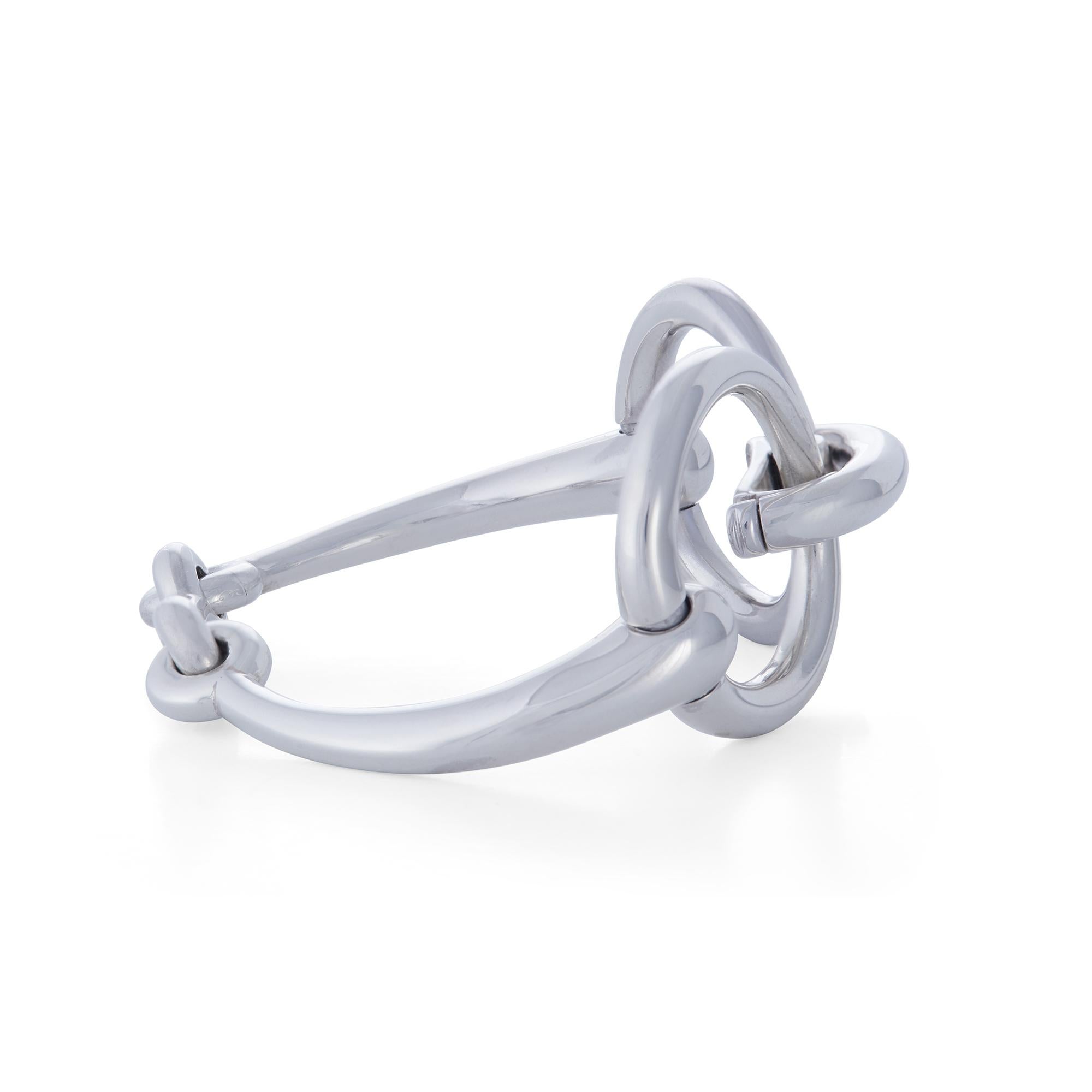 Authentic Hermès Filet de Selle bracelet crafted in sterling silver. Featuring the brand's iconic horsebit design, the finely crafted silver hugs the wrist comfortably for everyday wear.  The bracelet measures 6.5 inches in length.  Signed Hermès,