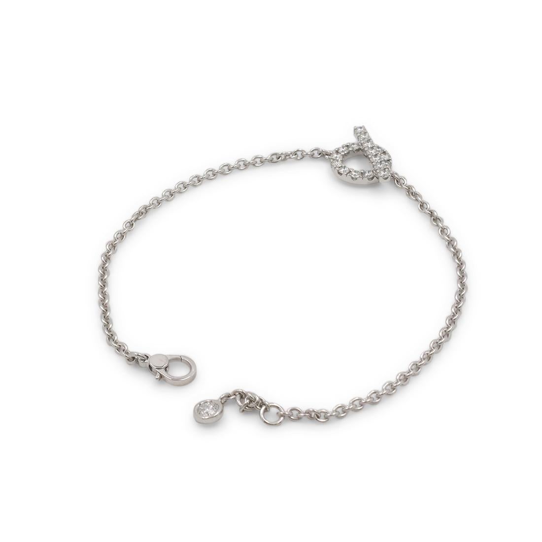 Authentic Hermès 'Finesse' bracelet crafted in 18 karat white gold and set with approximately 0.55 carats of high-quality diamonds. Featuring a motif inspired by a boat anchor, the bracelet measures 7 inches in length. Size 6 3/4 US, 17.5 EU. Signed