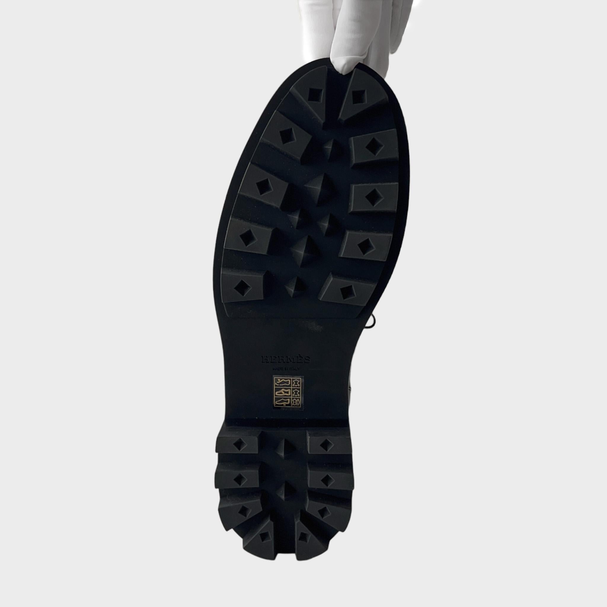 This is the Hermès take on the classic Derby Shoe. The Hermes First Derby Shoe is a modern take with the featuring of a classic palladium buckle and a chunky notched sole. It is a full set with dust bag, spare laces, box etc. It is a new shoe