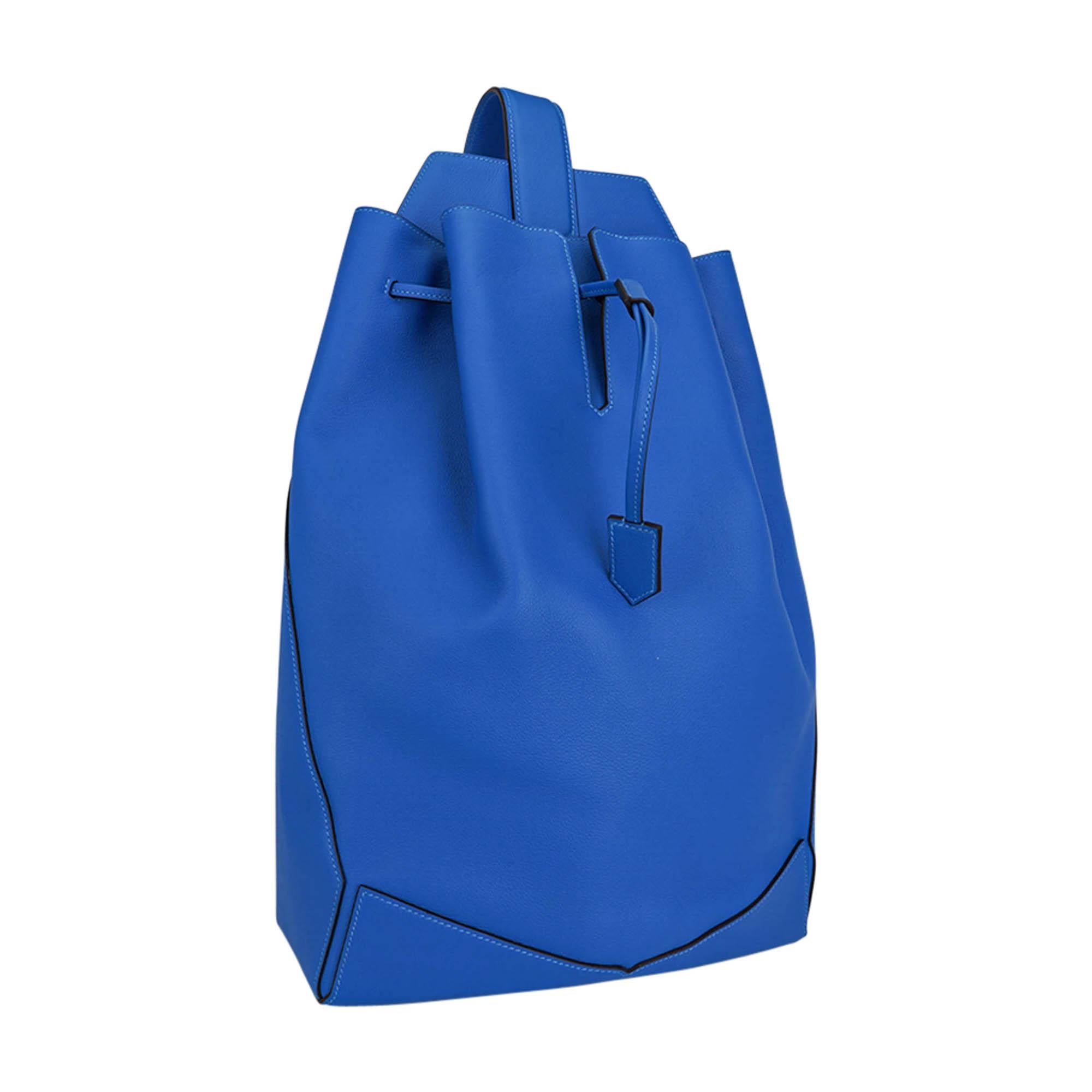 Mightychic offers an Hermes Flash Sailor sling backpack featured in Blue and Evercolor leather.
Bag has a leather drawstring closure one adjustable shoulder strap.
Sliding closure system.
Interior has a slot pocket and rear side zip
