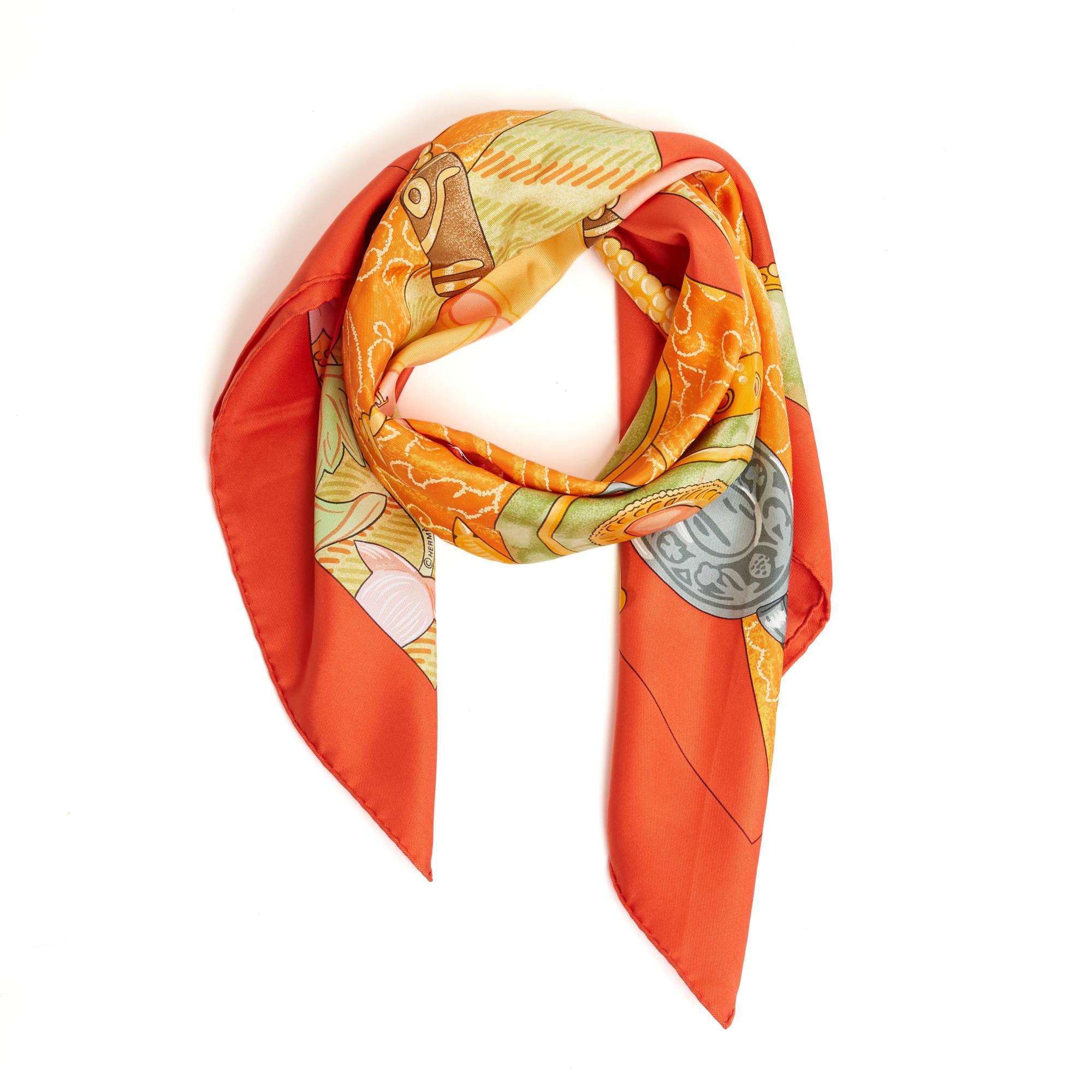 Hermès square scarf 90 in silk twill, Tibet II pattern by Cathy Latham, produced once in 2002, in shades of orange. Width 90 cm x length 90 cm approximately. The square has been worn but it seems in very good condition, sought-after model, cheerful