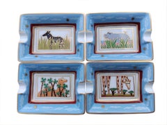 Hermès Four Small Ashtrays Trays Wild Animals Africa Print Porcelain Gold